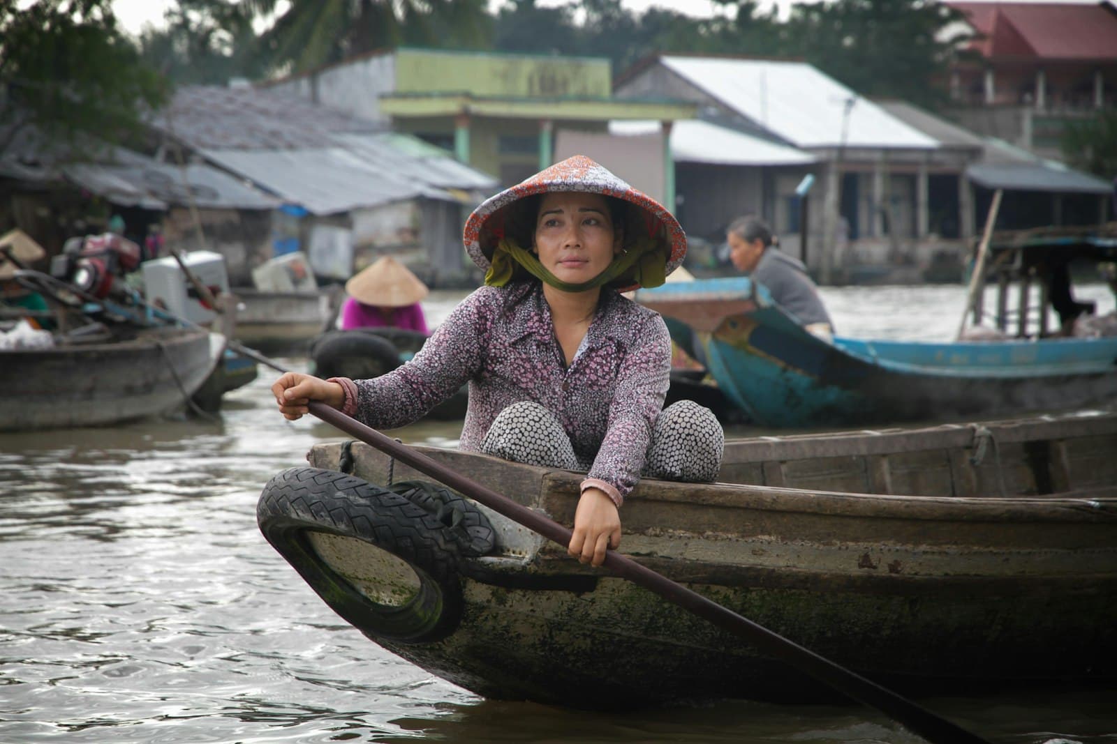 Cần Thơ — woman paddling on boat