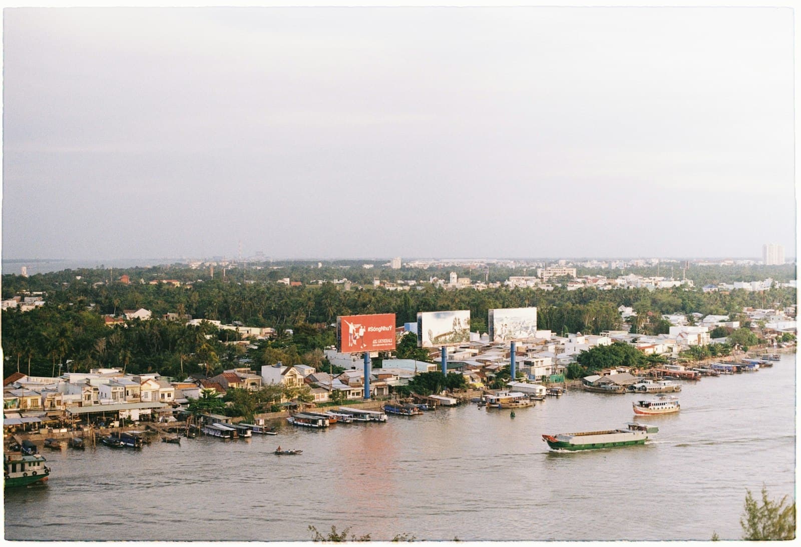 Cần Thơ — a river filled with lots of boats next to a city