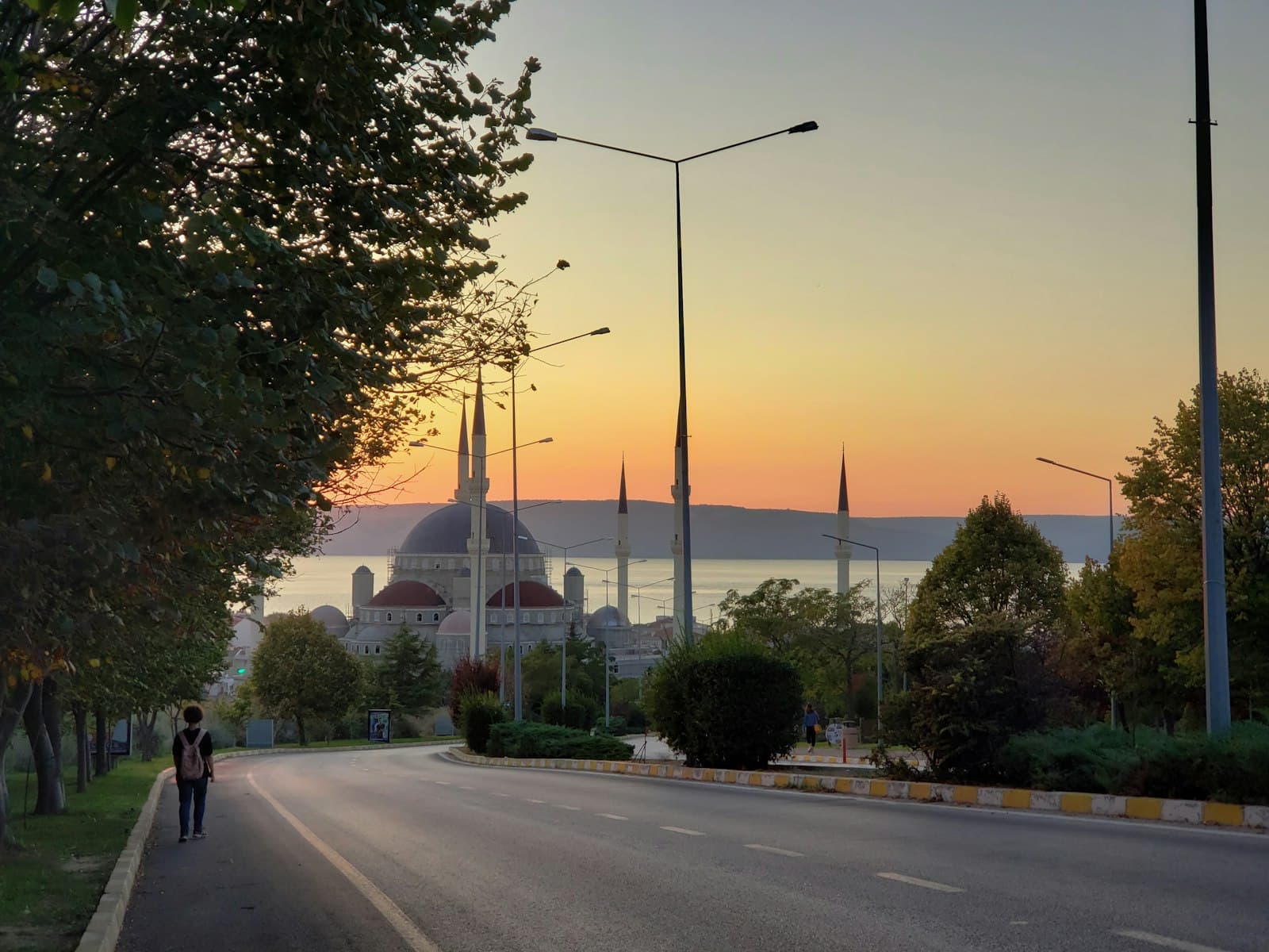 Çanakkale — a couple of people walking down a street