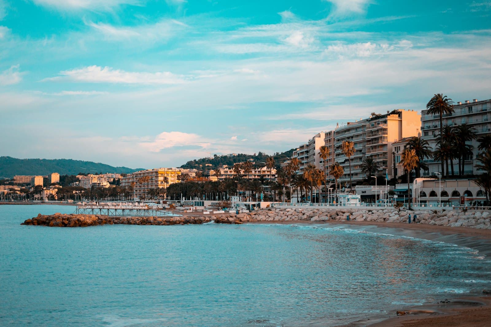 Cannes — city buildings near body of water under blue sky during daytime