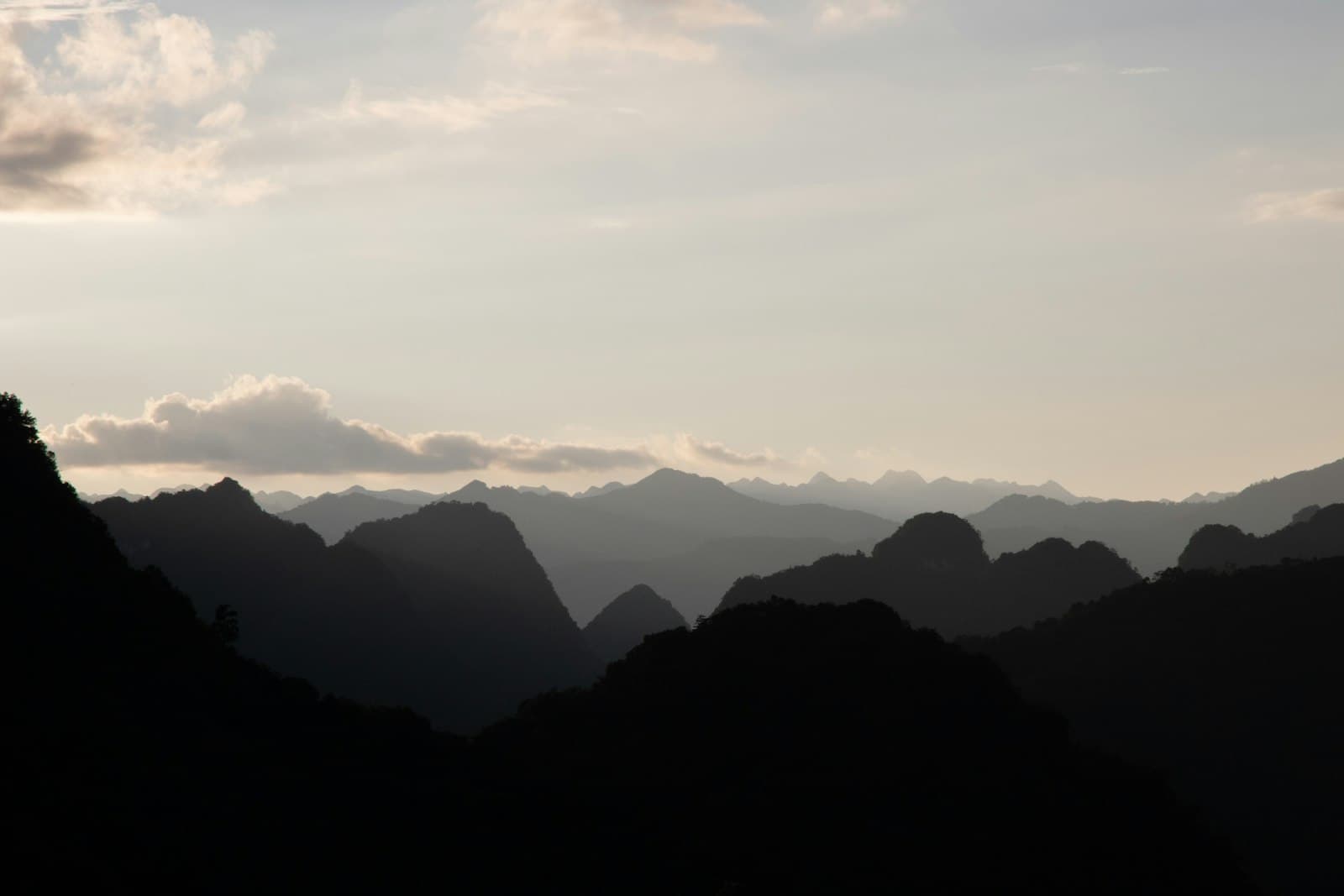 Cao Bằng — the silhouette of a mountain range against a cloudy sky