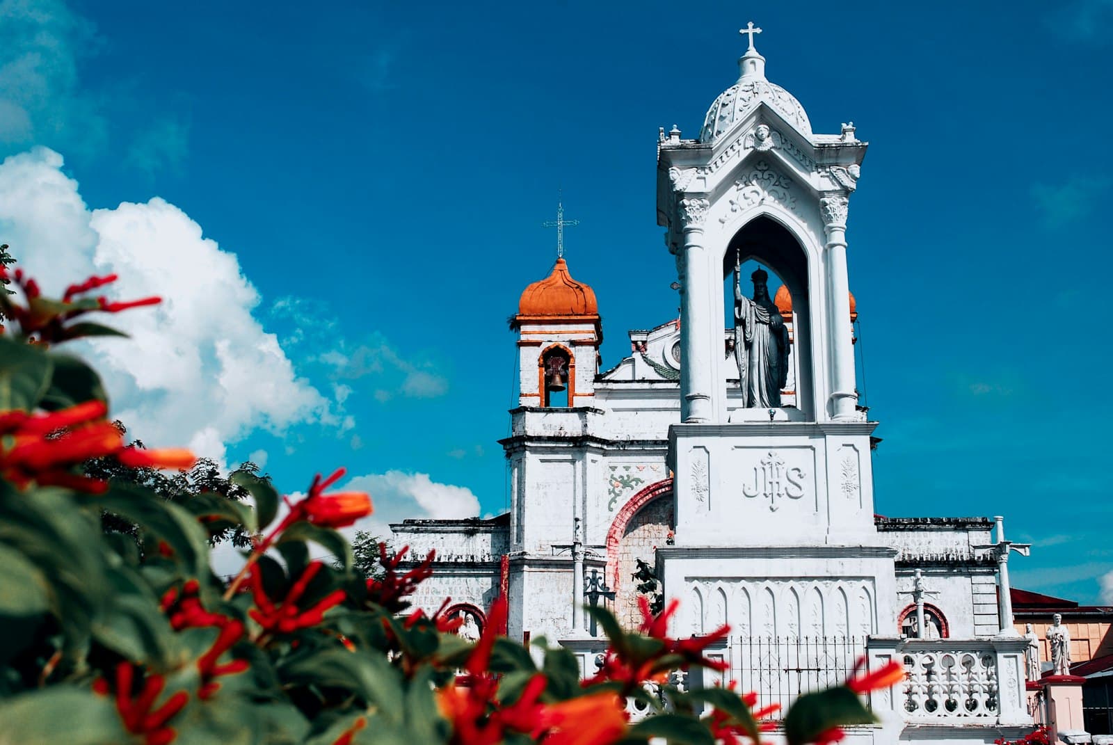 Carcar — Beautiful church stands under a bright, blue sky.