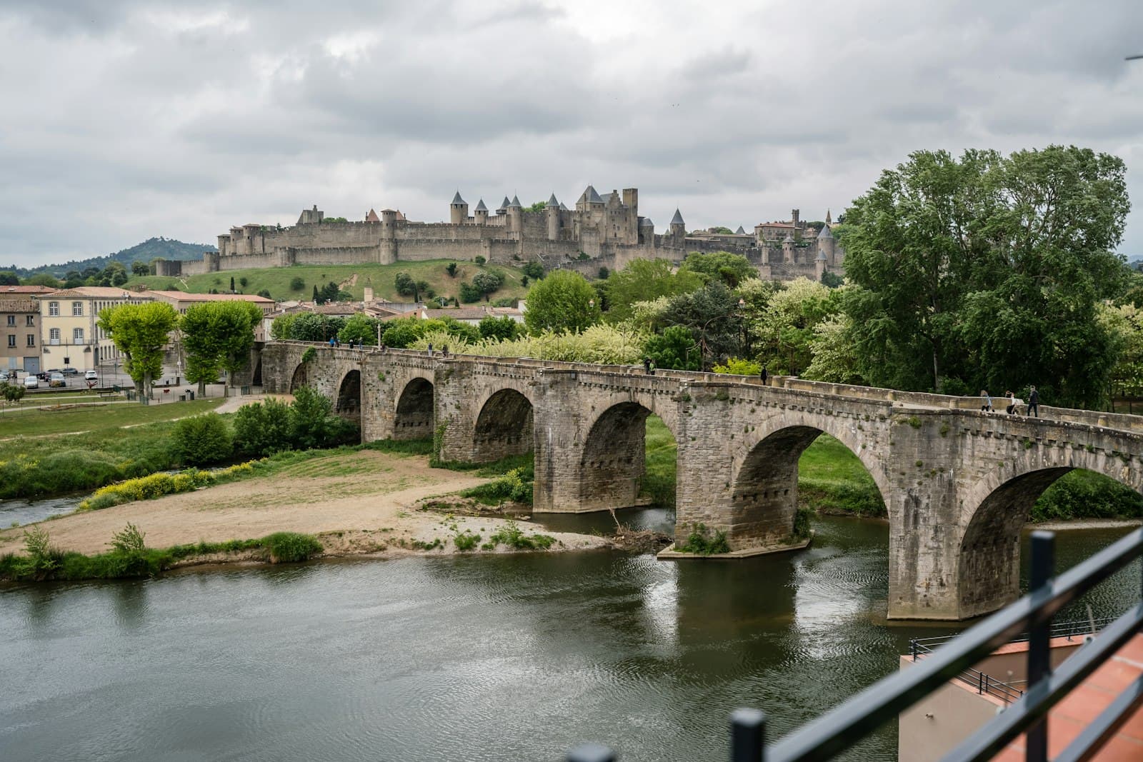 Carcassonne — gray concrete bridge over river during daytime