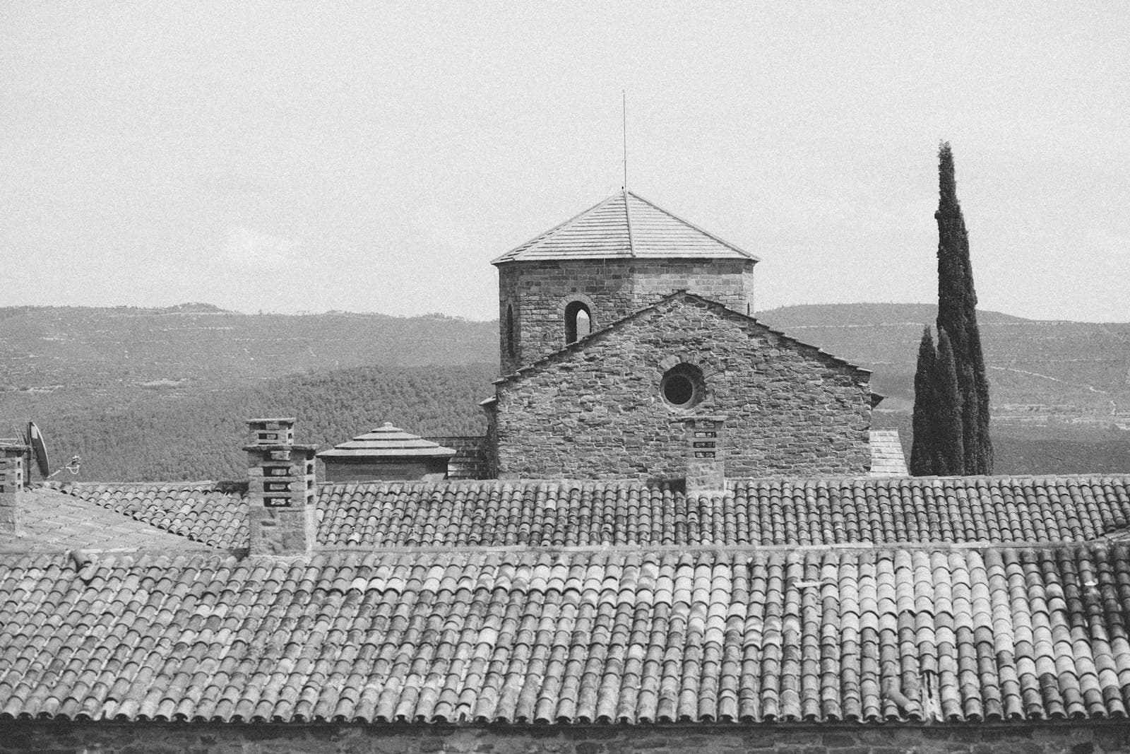 Cardona — a black and white photo of a building with a clock tower