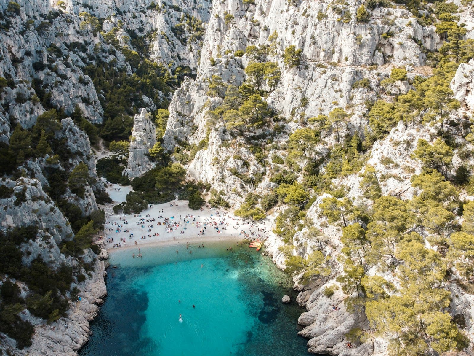 Cassis — aerial view of body of water between gray rocky mountain during daytime