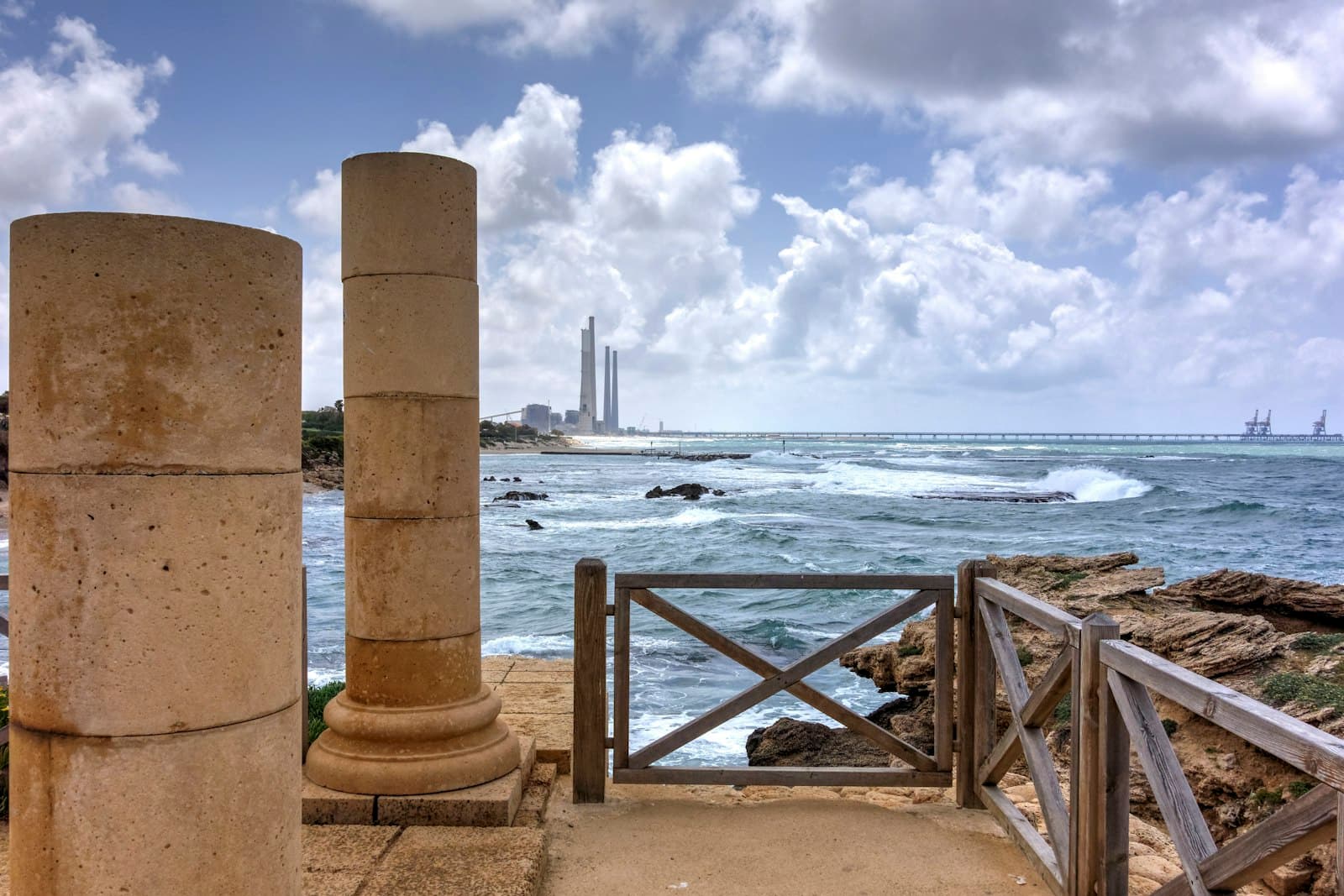 Caesarea — brown wooden dock on sea under white clouds during daytime