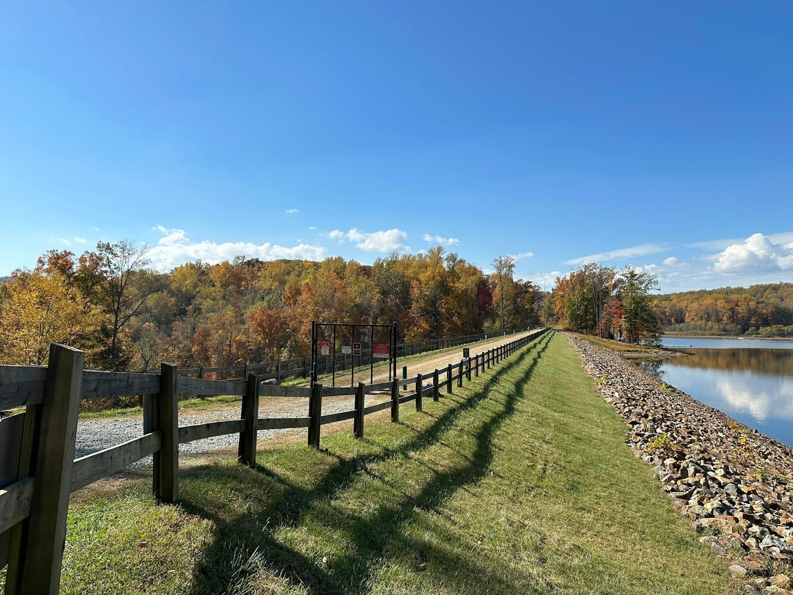 Charlottesville — a wooden fence next to a body of water