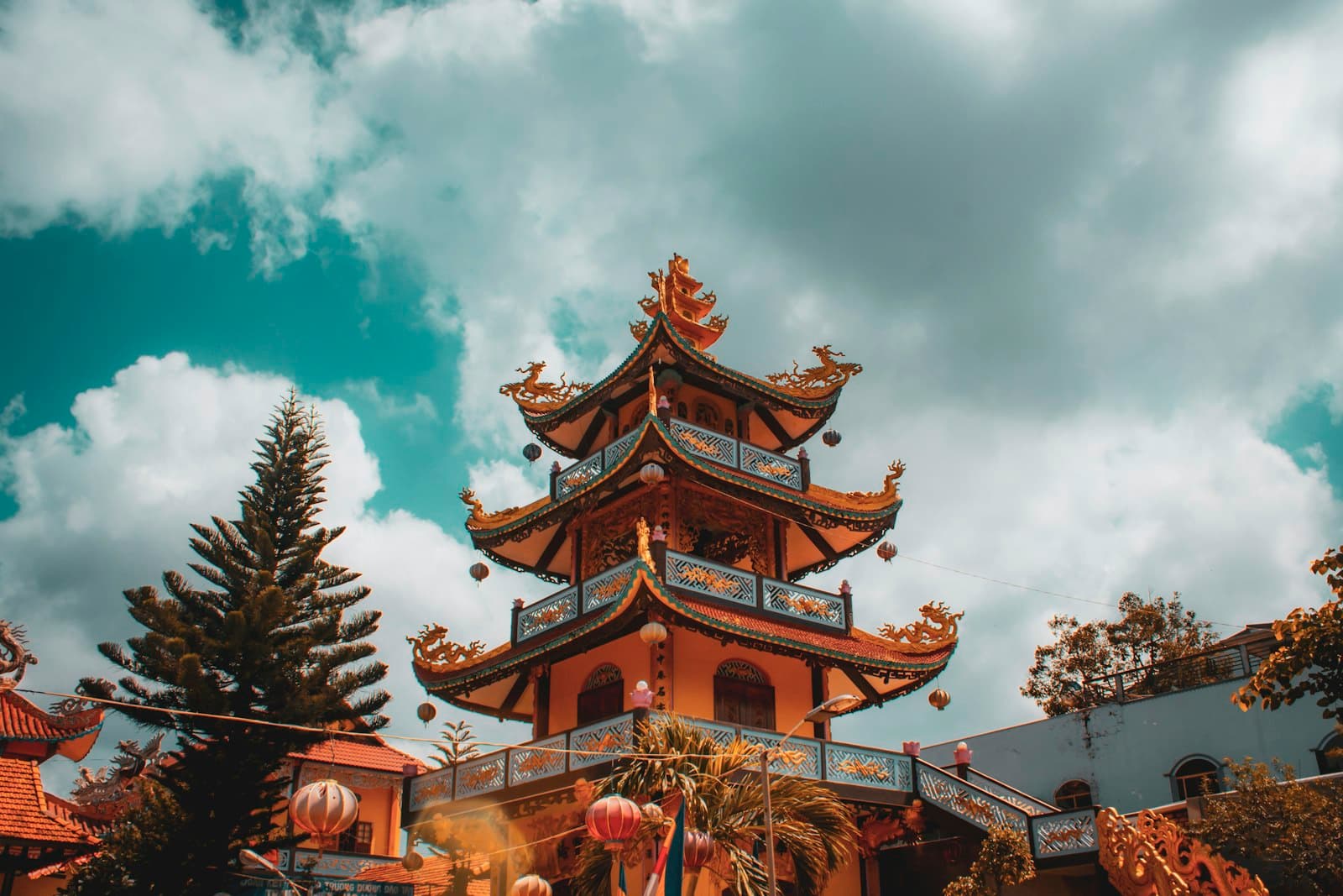 Châu Đốc — brown and green pagoda temple under blue sky