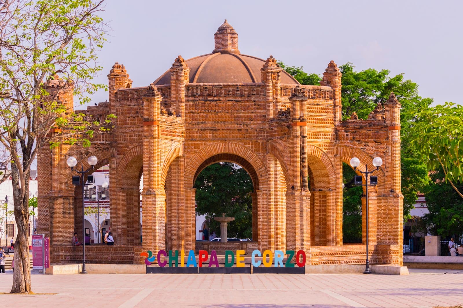 Chiapa de Corzo — a brick building with a colorful sign in front of it