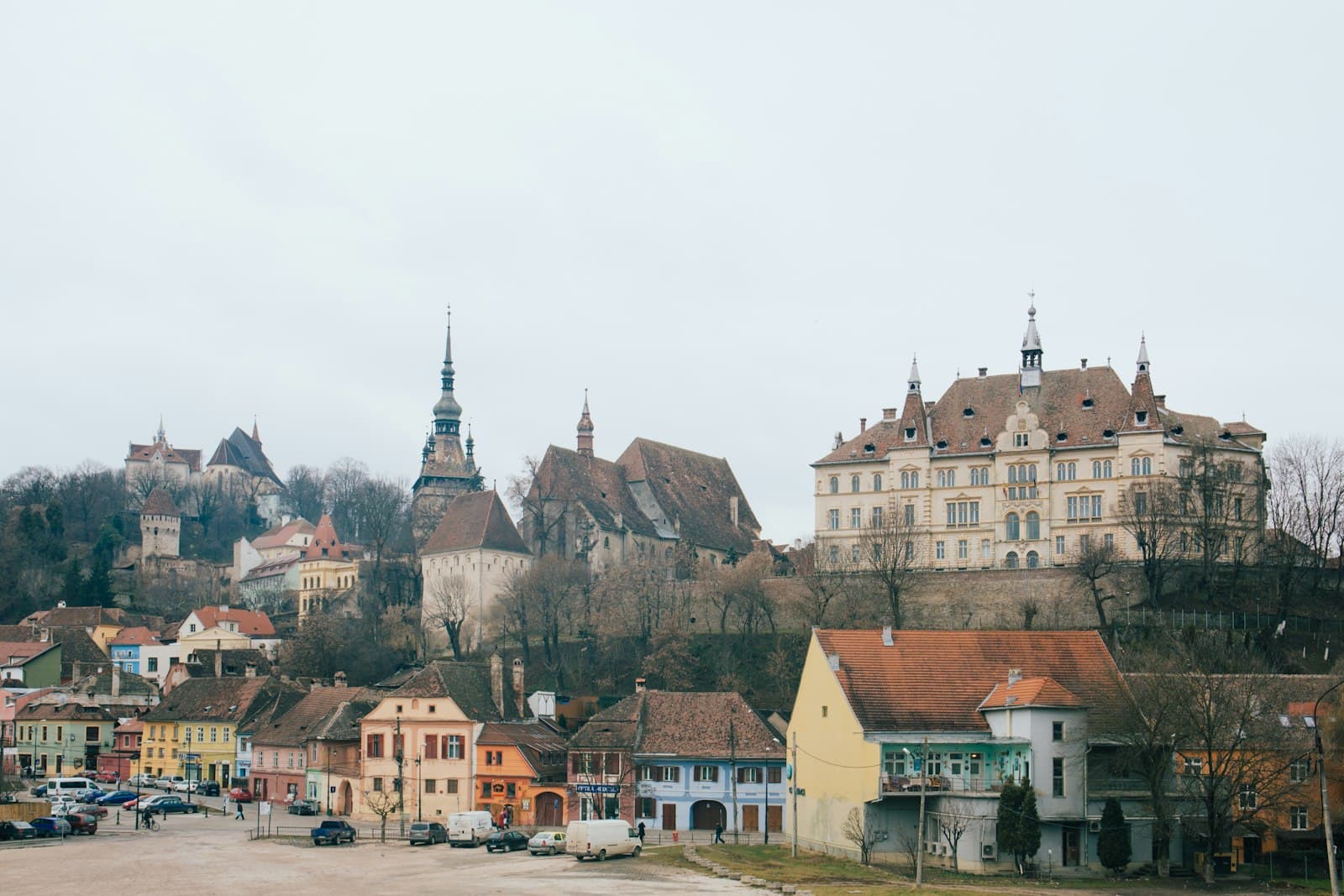 Cisnădie — beige and brown gothic building on hill