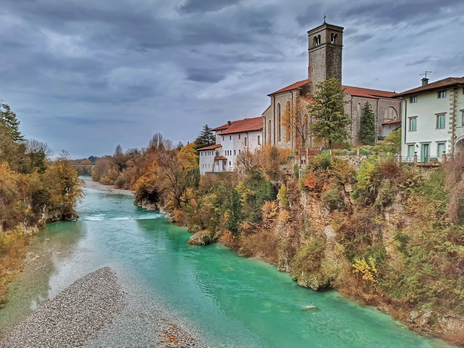 Cividale del Friuli — A river running through a lush green forest