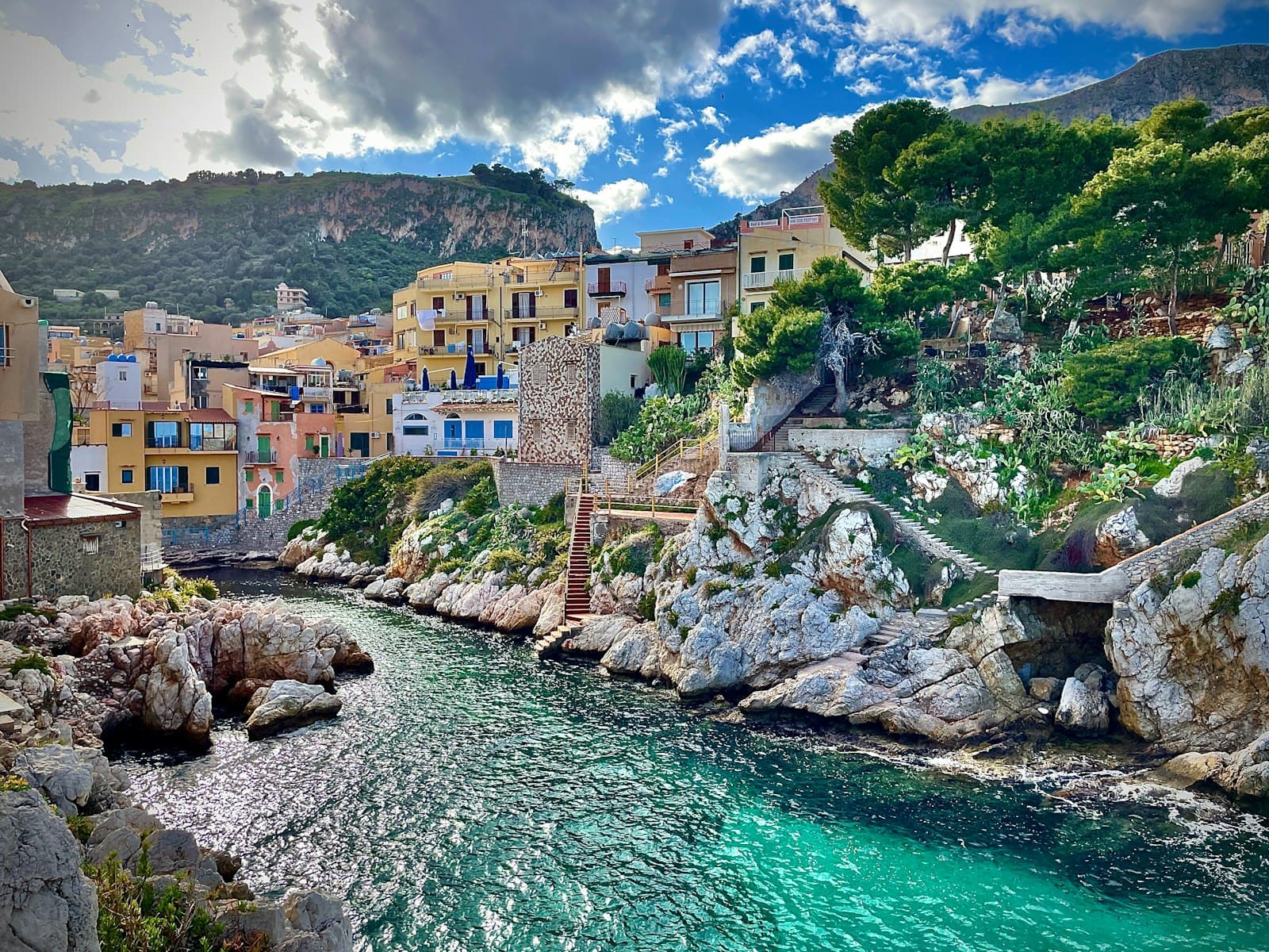 Civita — A river running through a lush green hillside