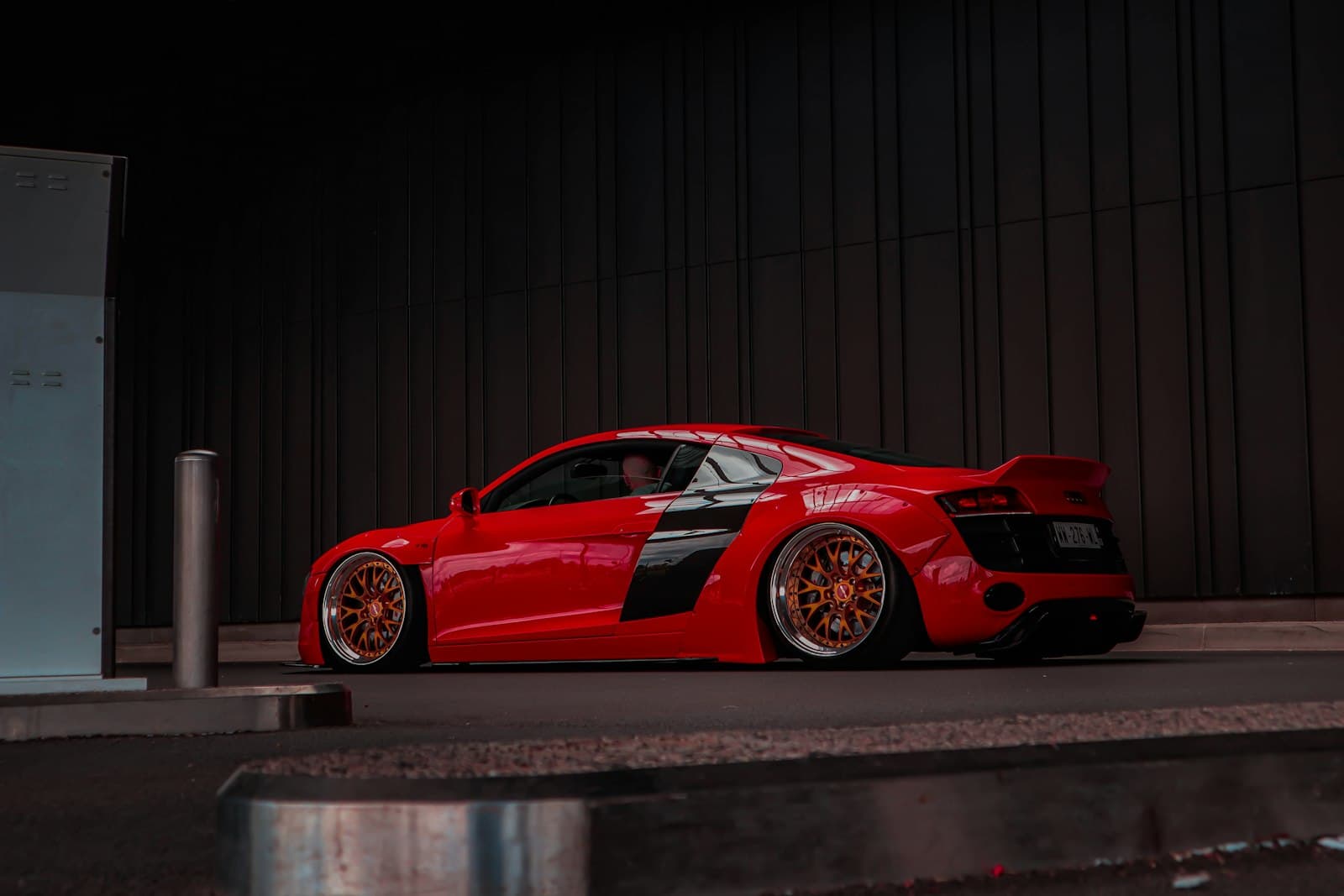 Clermont-Ferrand — a red sports car parked in front of a building