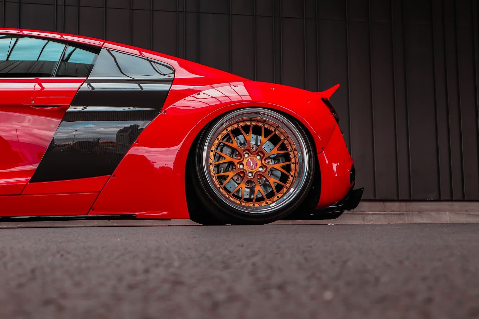 Clermont-Ferrand — a red sports car parked in front of a building