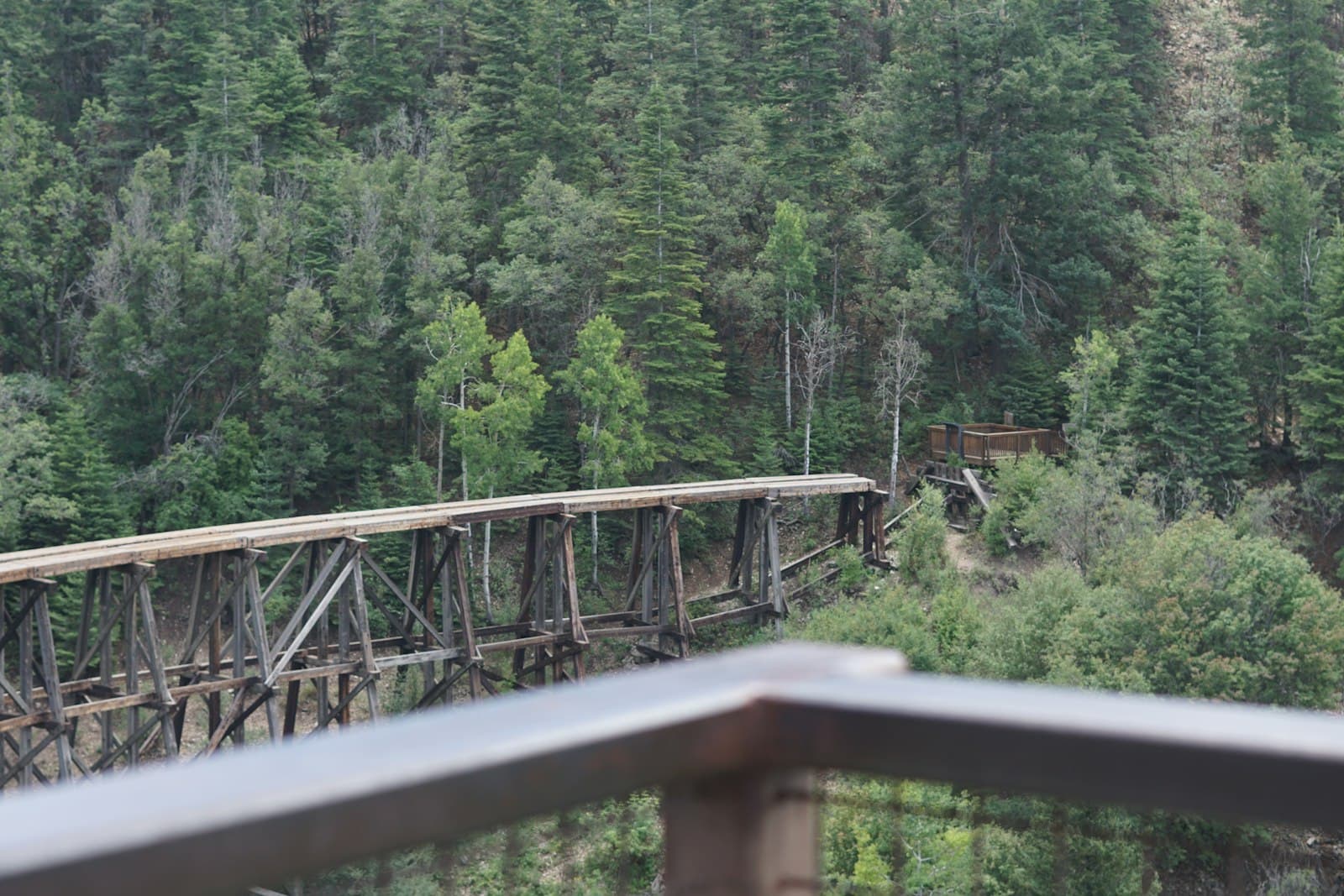 Cloudcroft — A train traveling over a bridge over a river