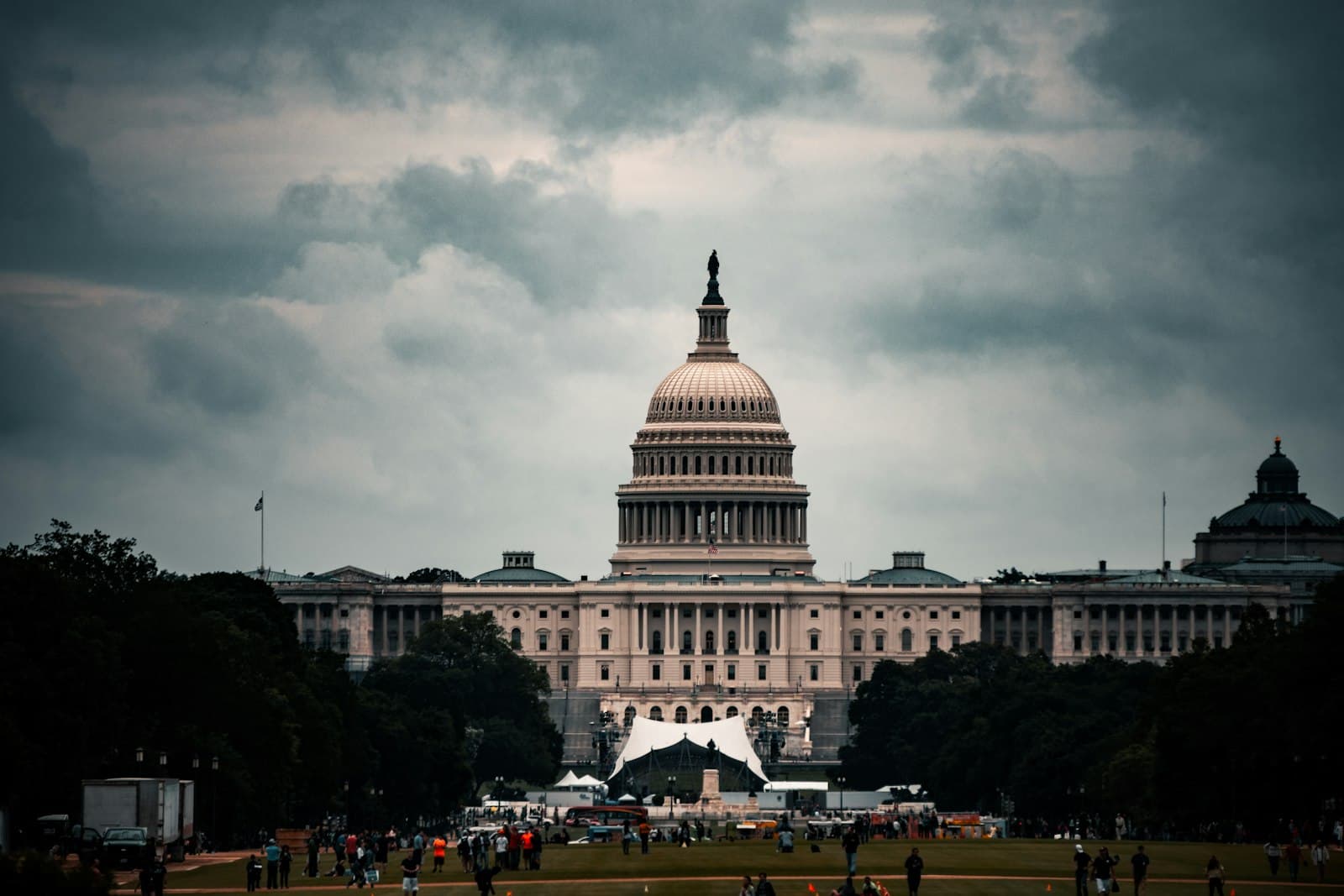 Columbia — white concrete building under gray clouds during daytime
