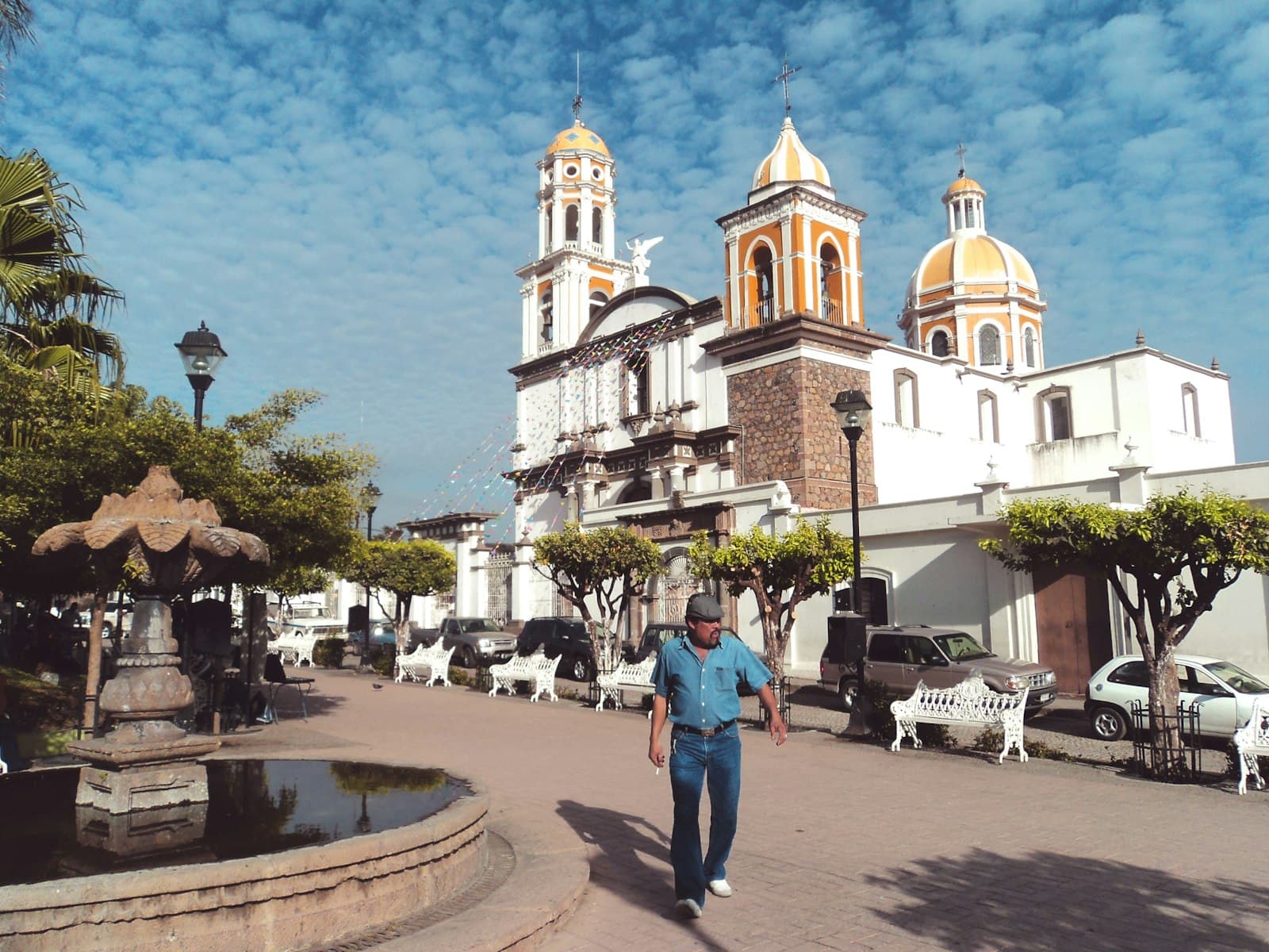 Comala — man standing near fountain
