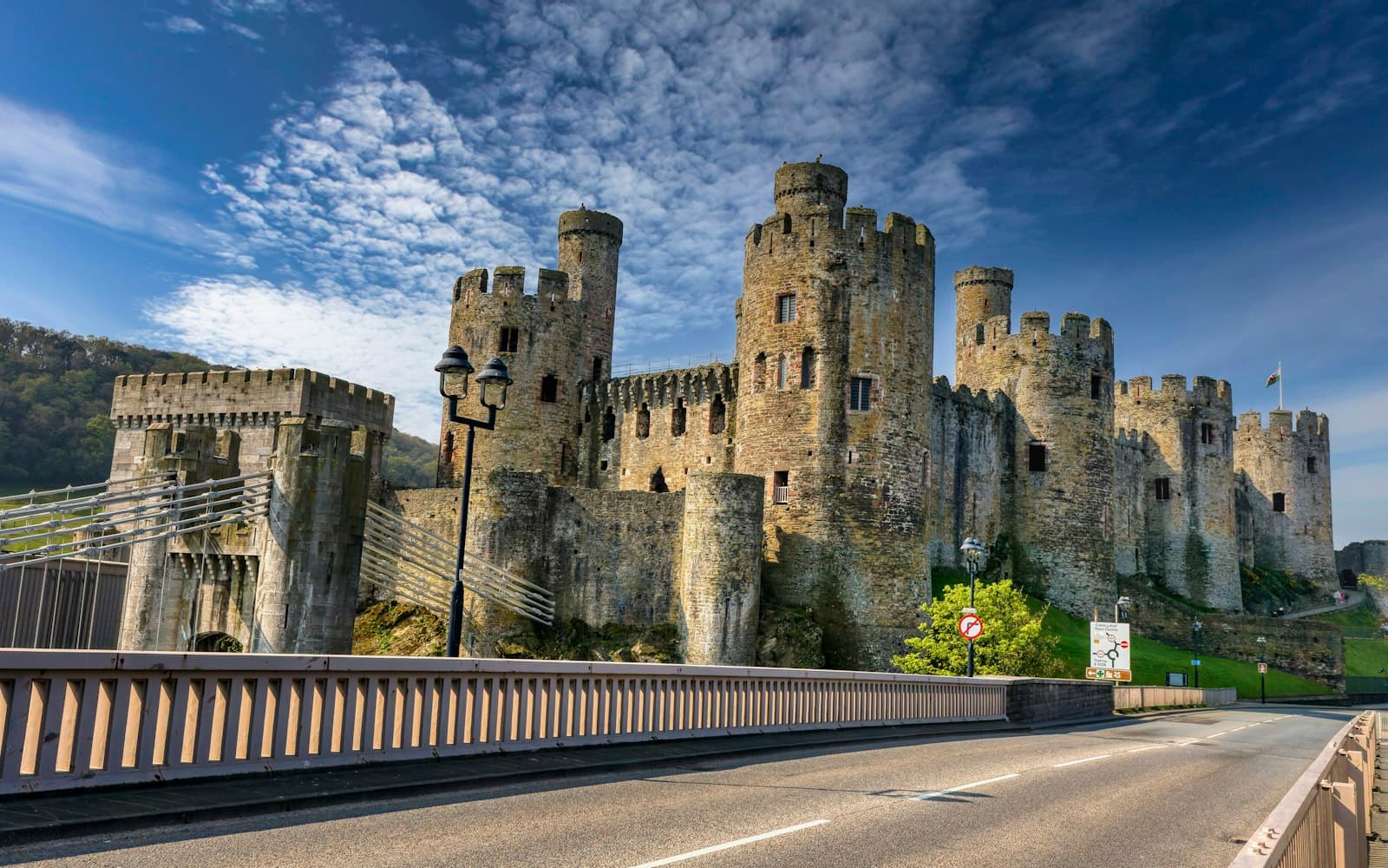 Conwy — a large castle sitting on the side of a road