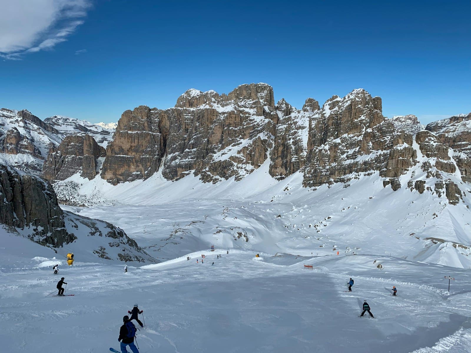 Cortina d'Ampezzo — person in black jacket and black pants standing on snow covered ground during daytime