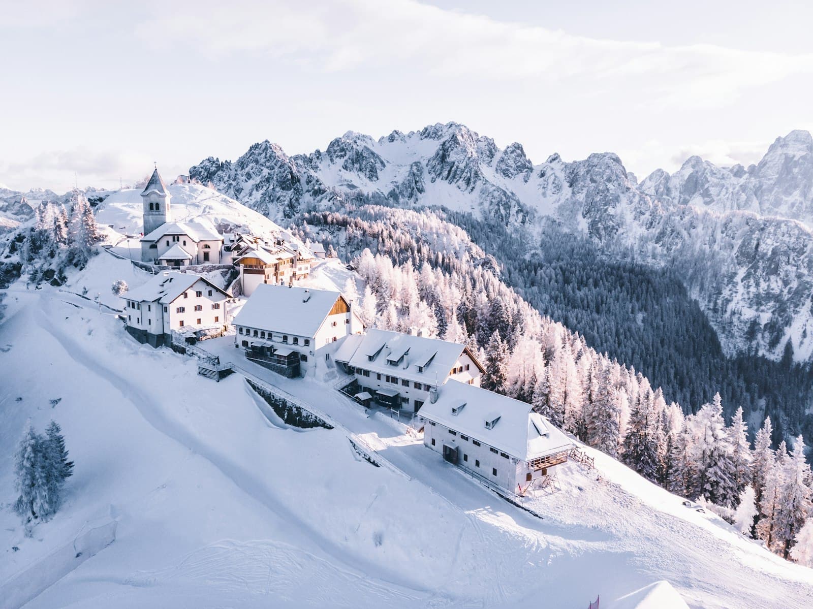 Cortina d'Ampezzo — houses on mountain covered with snow