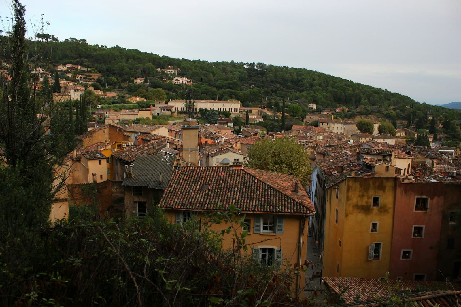 Cotignac — a view of a small village with a hill in the background