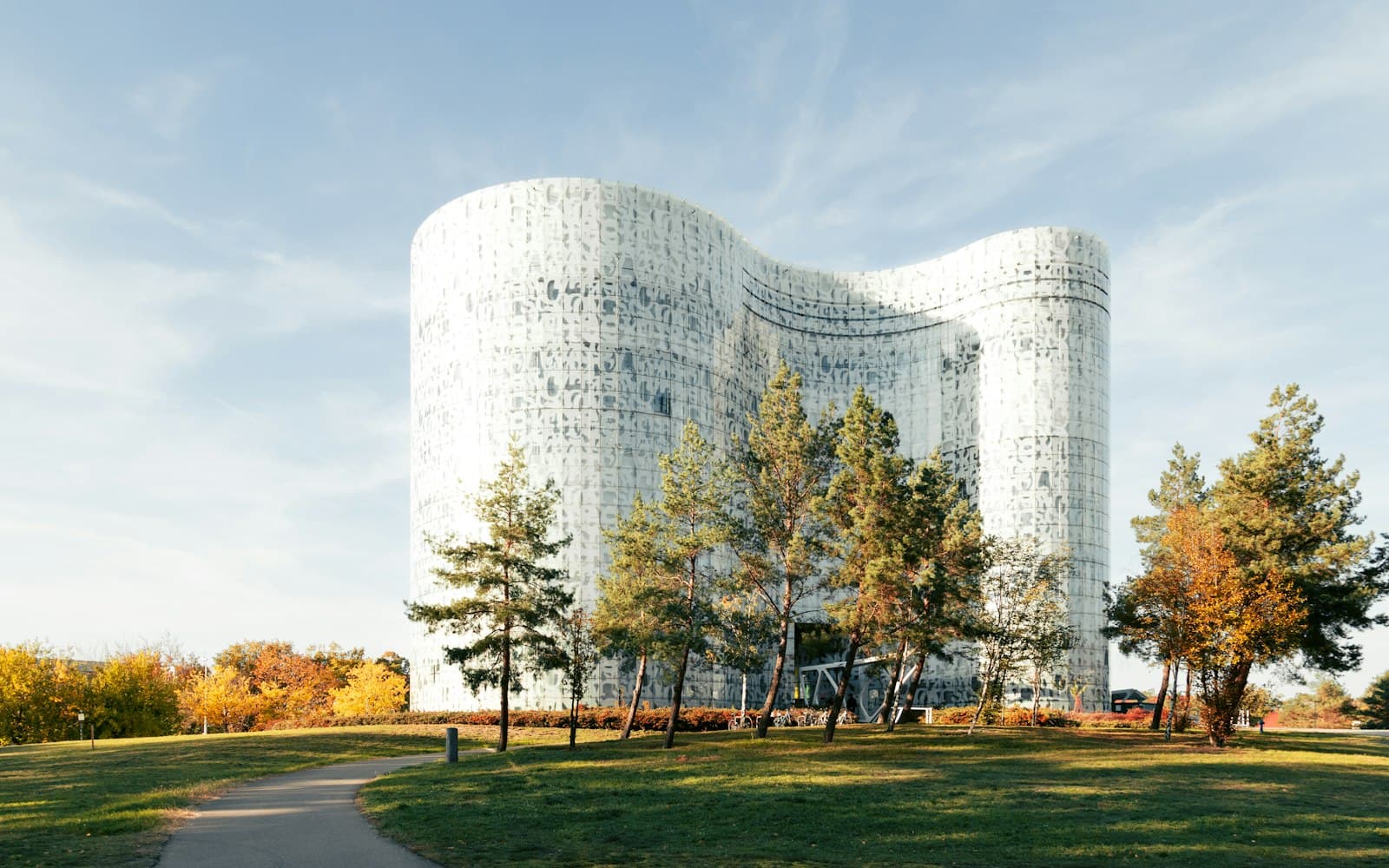 Cottbus — A large white building sitting on top of a lush green field