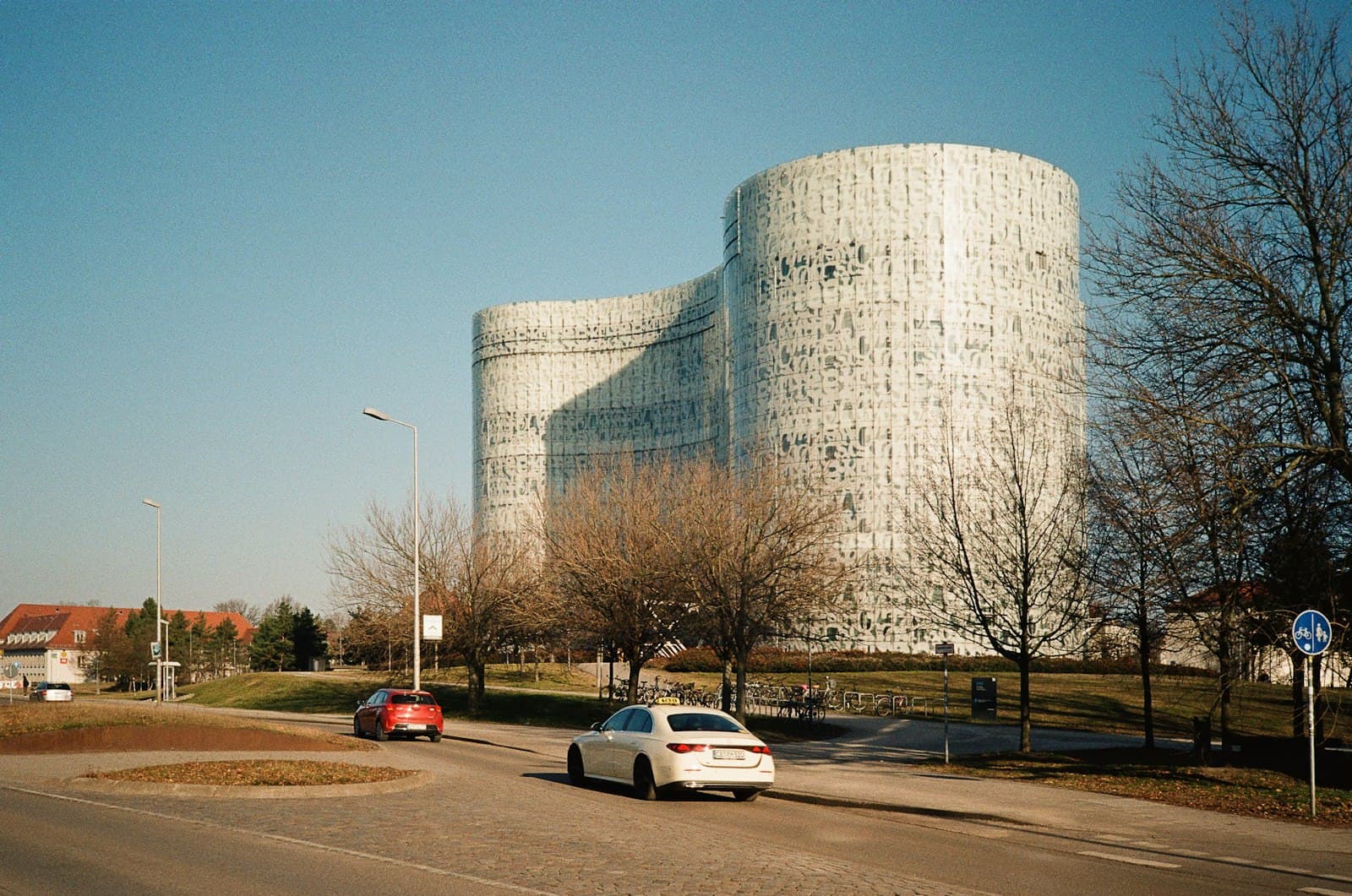 Cottbus — Modern white building with curved facade and bare trees