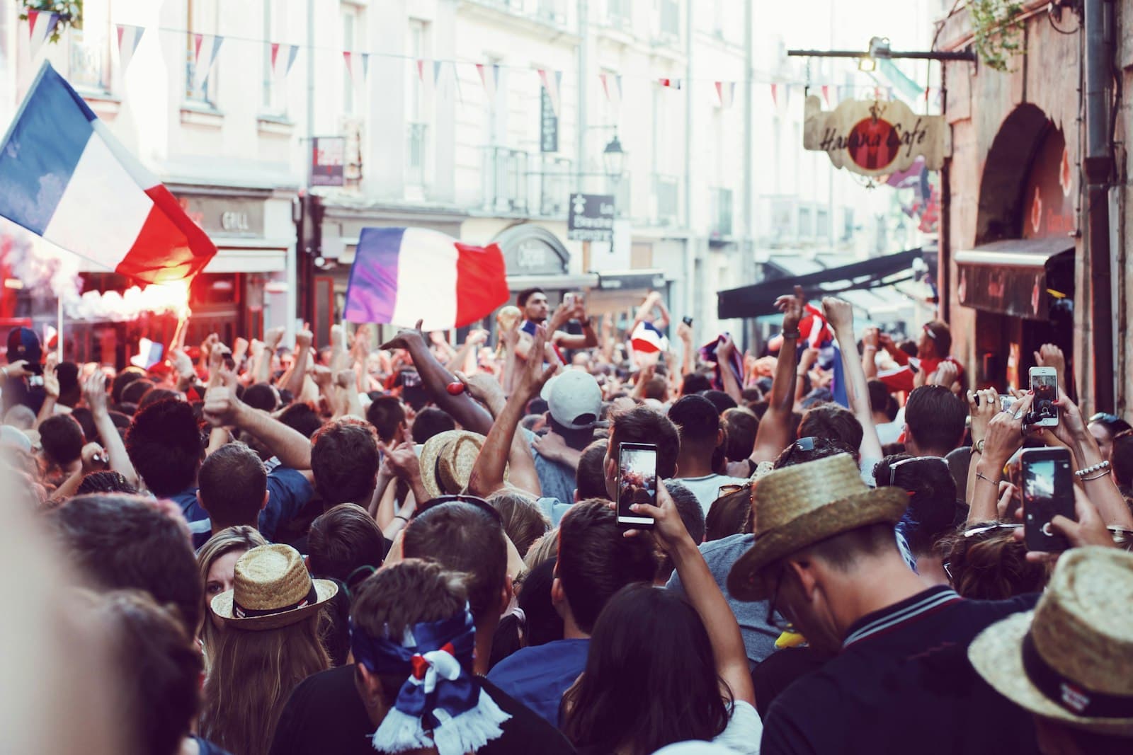 Crémieu — group of people standing between houses