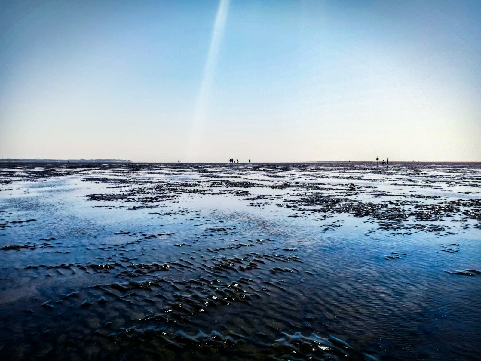 Daman — body of water under clear blue sky