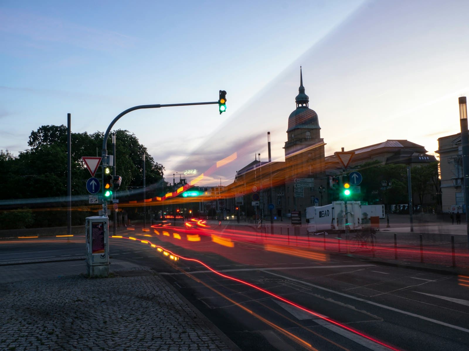 Darmstadt — a city street with traffic lights and a clock tower in the background