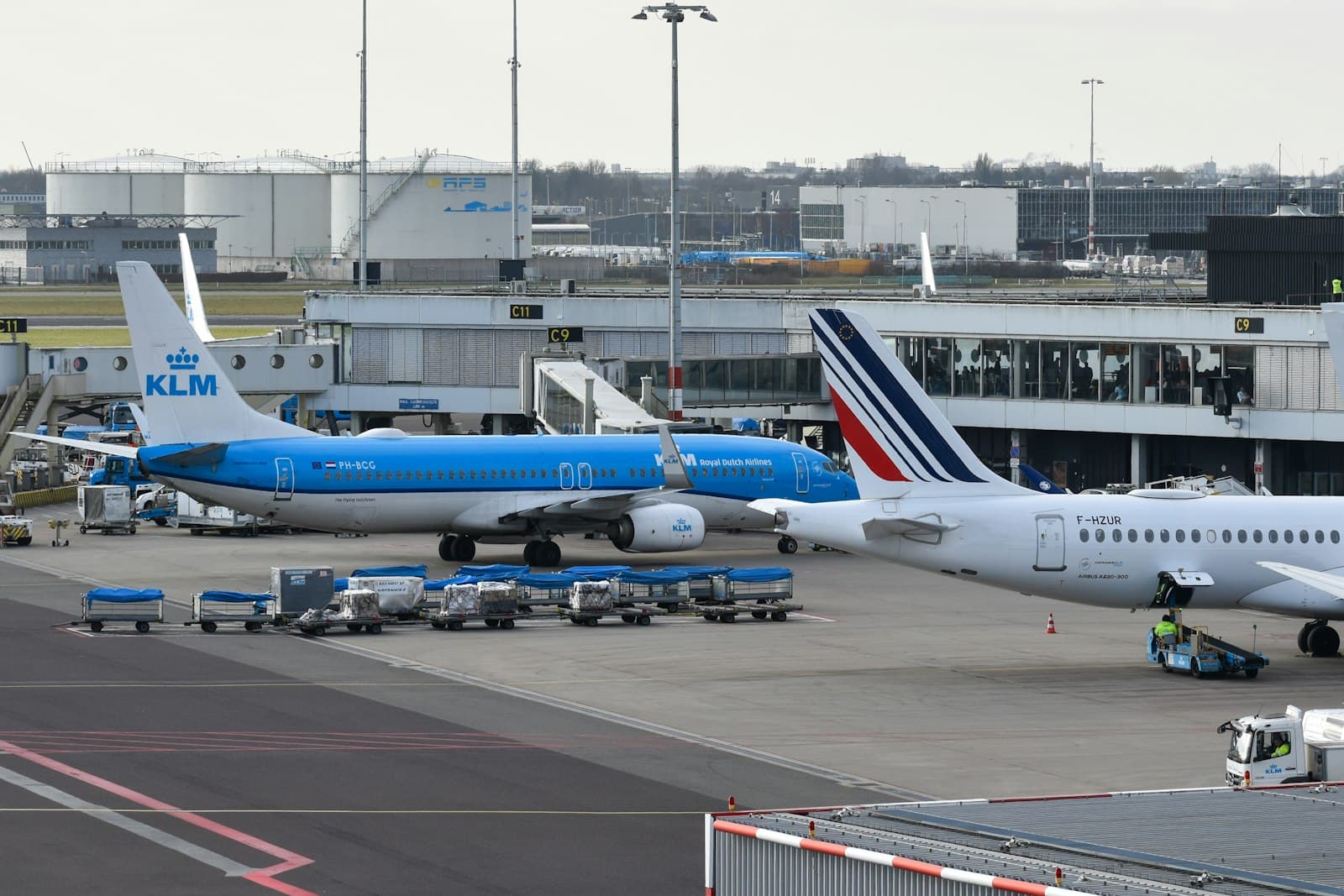 Dax — Airplanes are parked at an airport terminal.