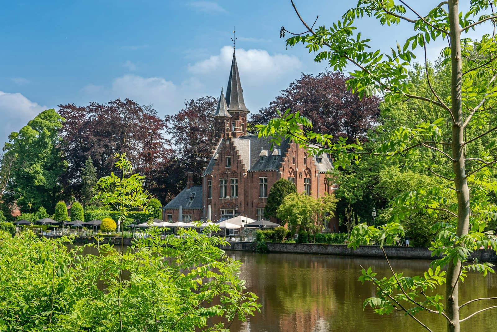 Diest — a large building sitting next to a body of water