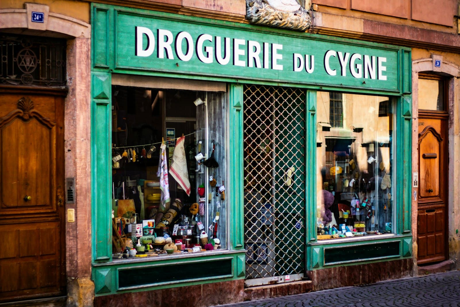 Digne-les-Bains — Old storefront with green facade and signage