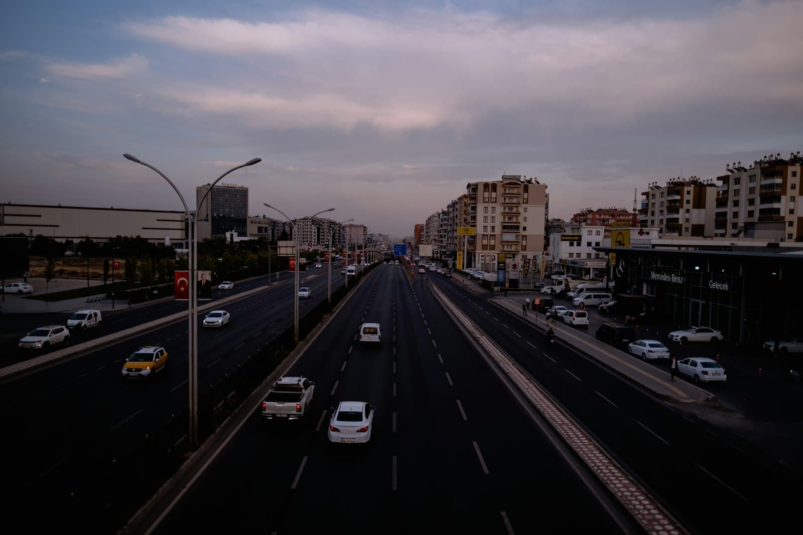 Diyarbakır — a city street filled with lots of traffic under a cloudy sky