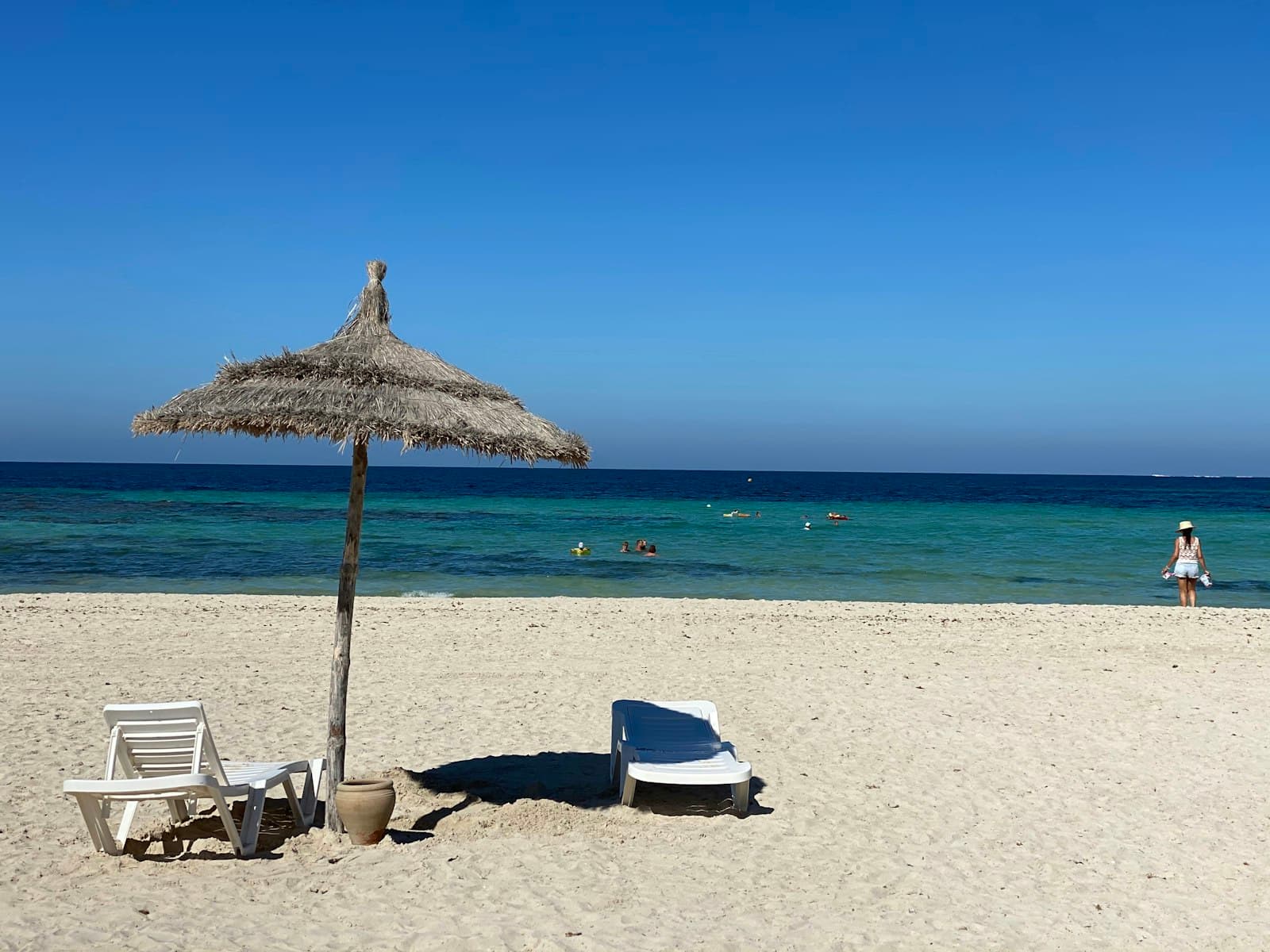 Djerba — brown beach umbrellas on beach during daytime