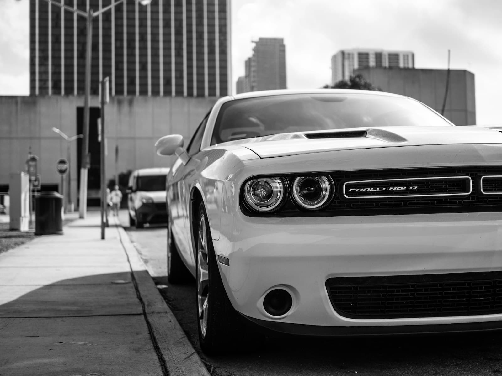 Dodge City — white Dodge Challenger parked beside curb
