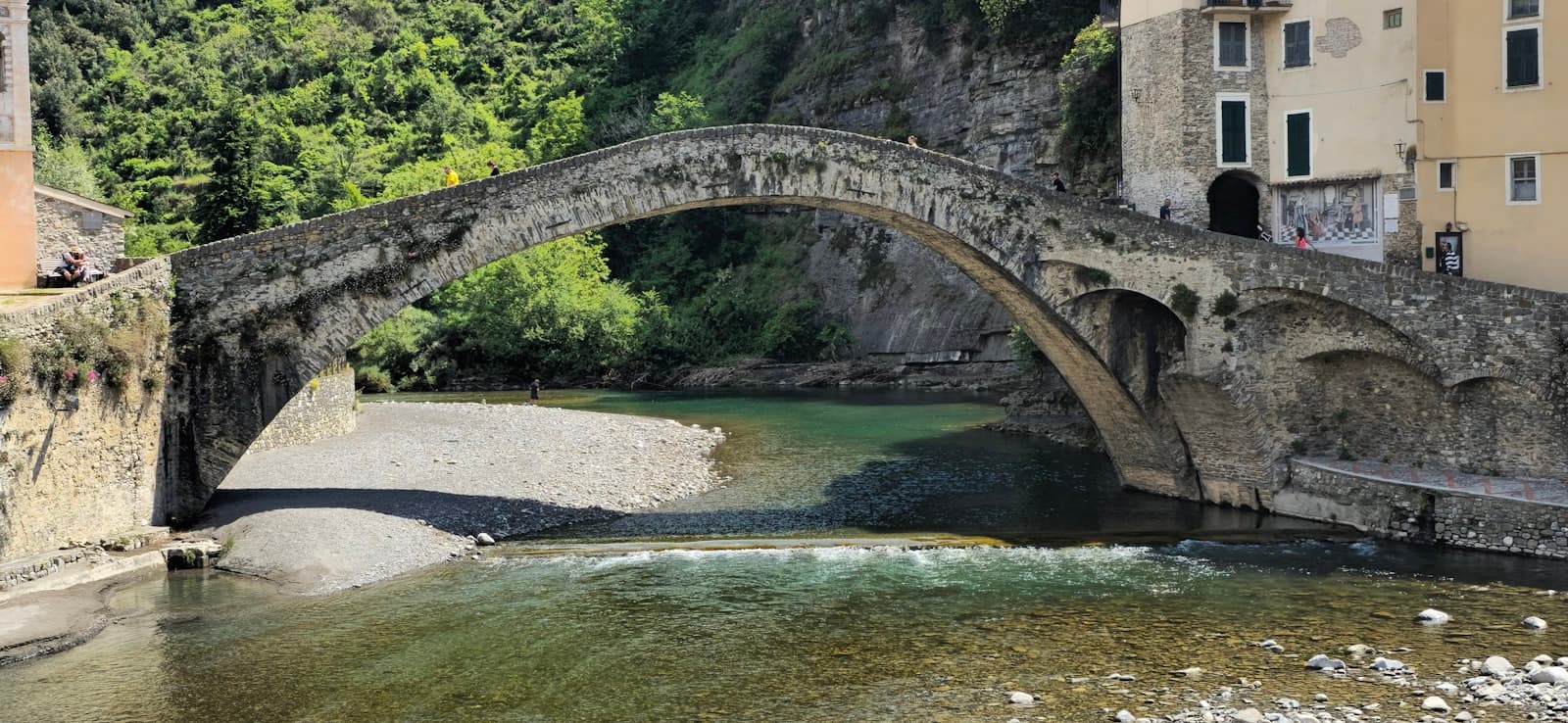 Dolceacqua — An old stone bridge crosses over the river.