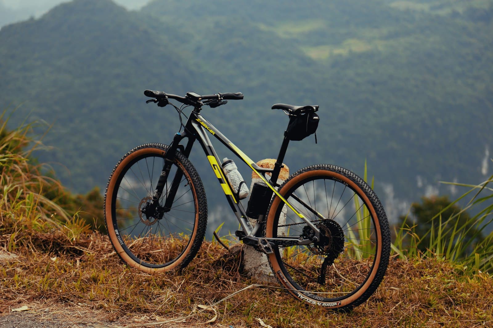 Đồng Văn — a bicycle parked on top of a grass covered hillside