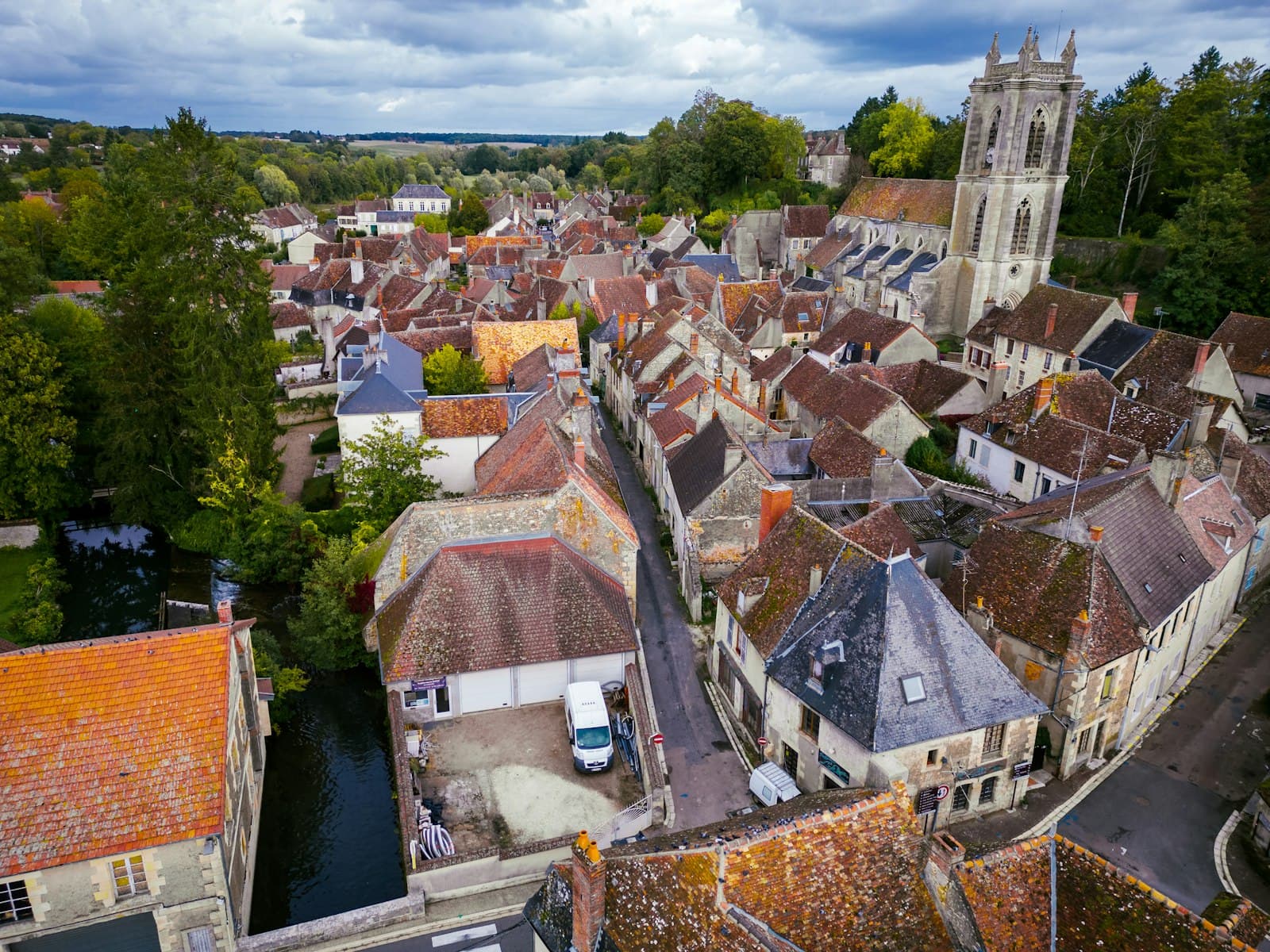 Donzy — an aerial view of a city with a river running through it