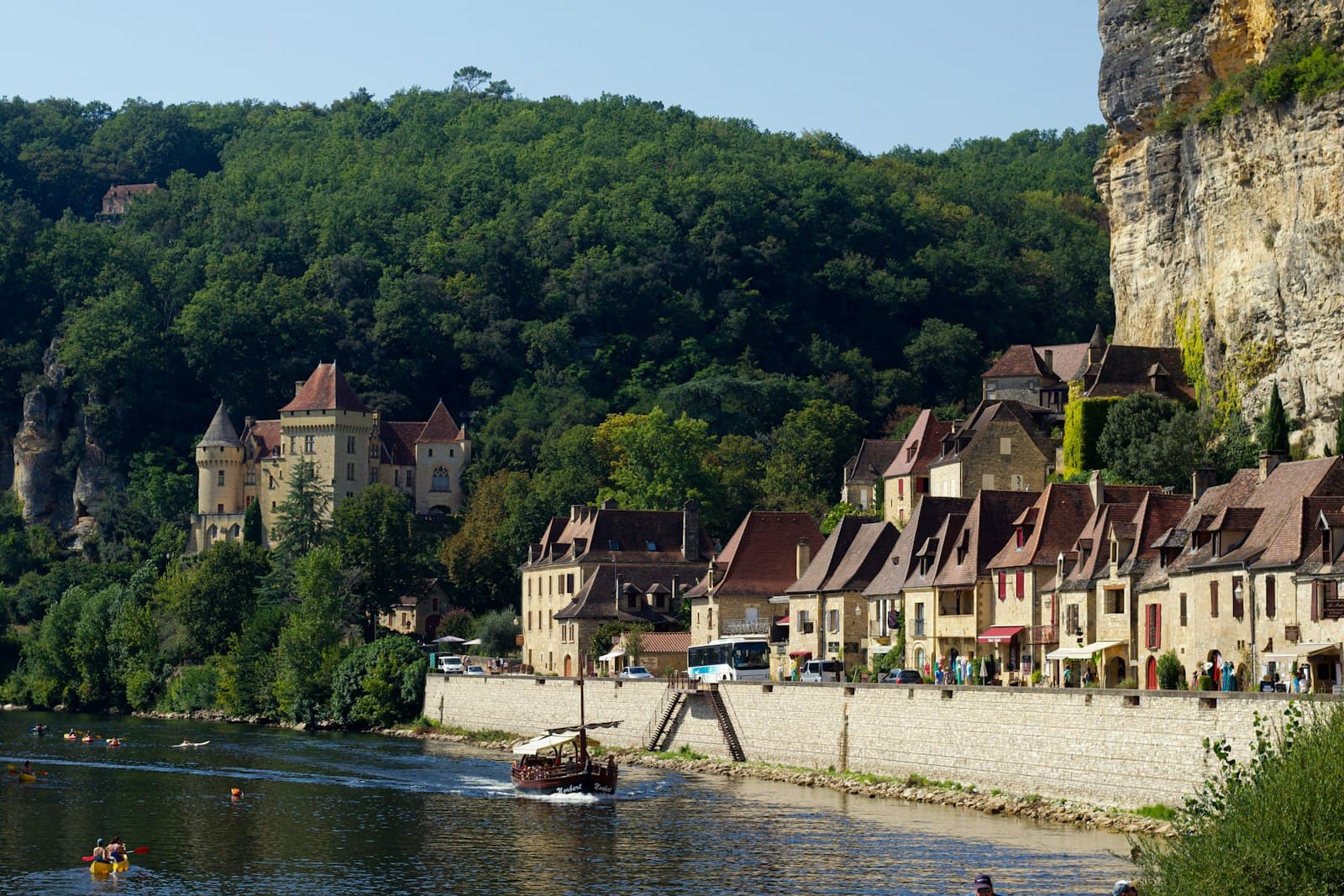 Dourdan — a small boat is on the river near a village