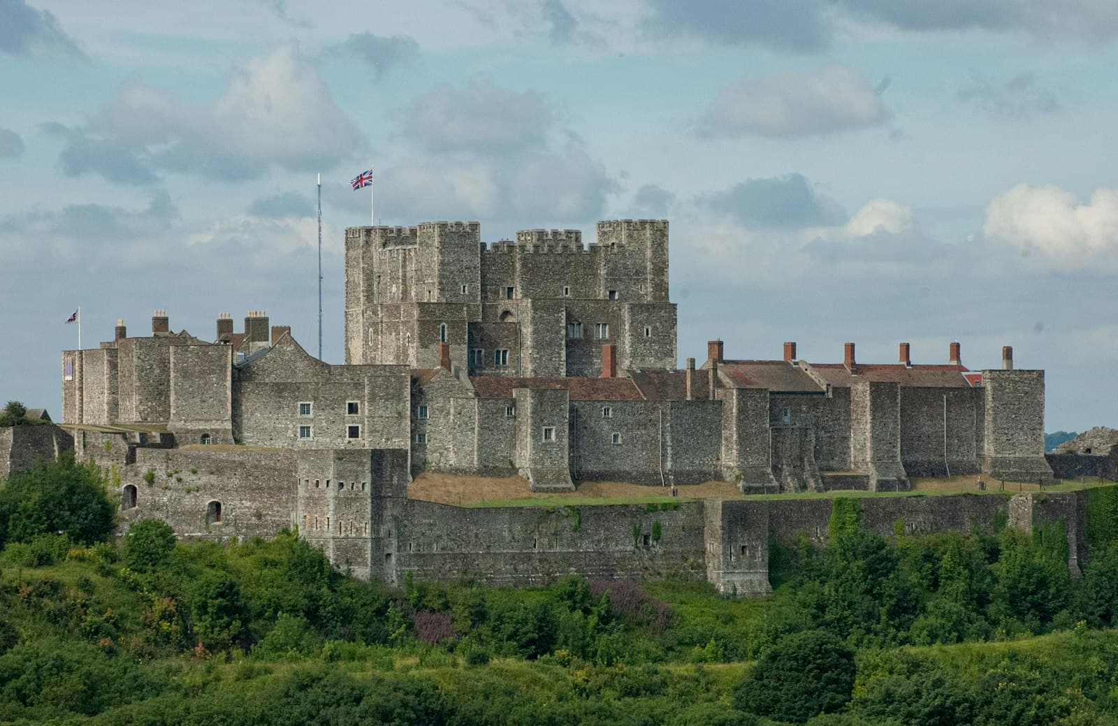 Dover — brown concrete castle under white clouds during daytime