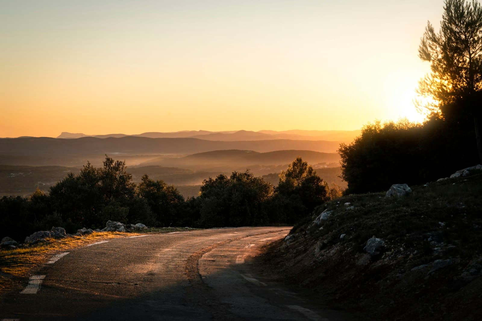 Draguignan — the sun is setting over the mountains on the road