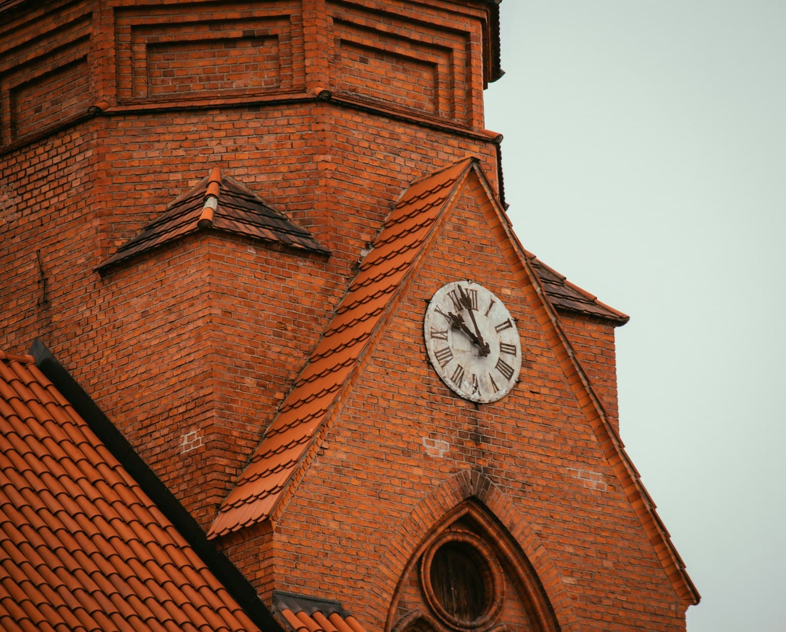 Druskininkai — a clock on the side of a brick building