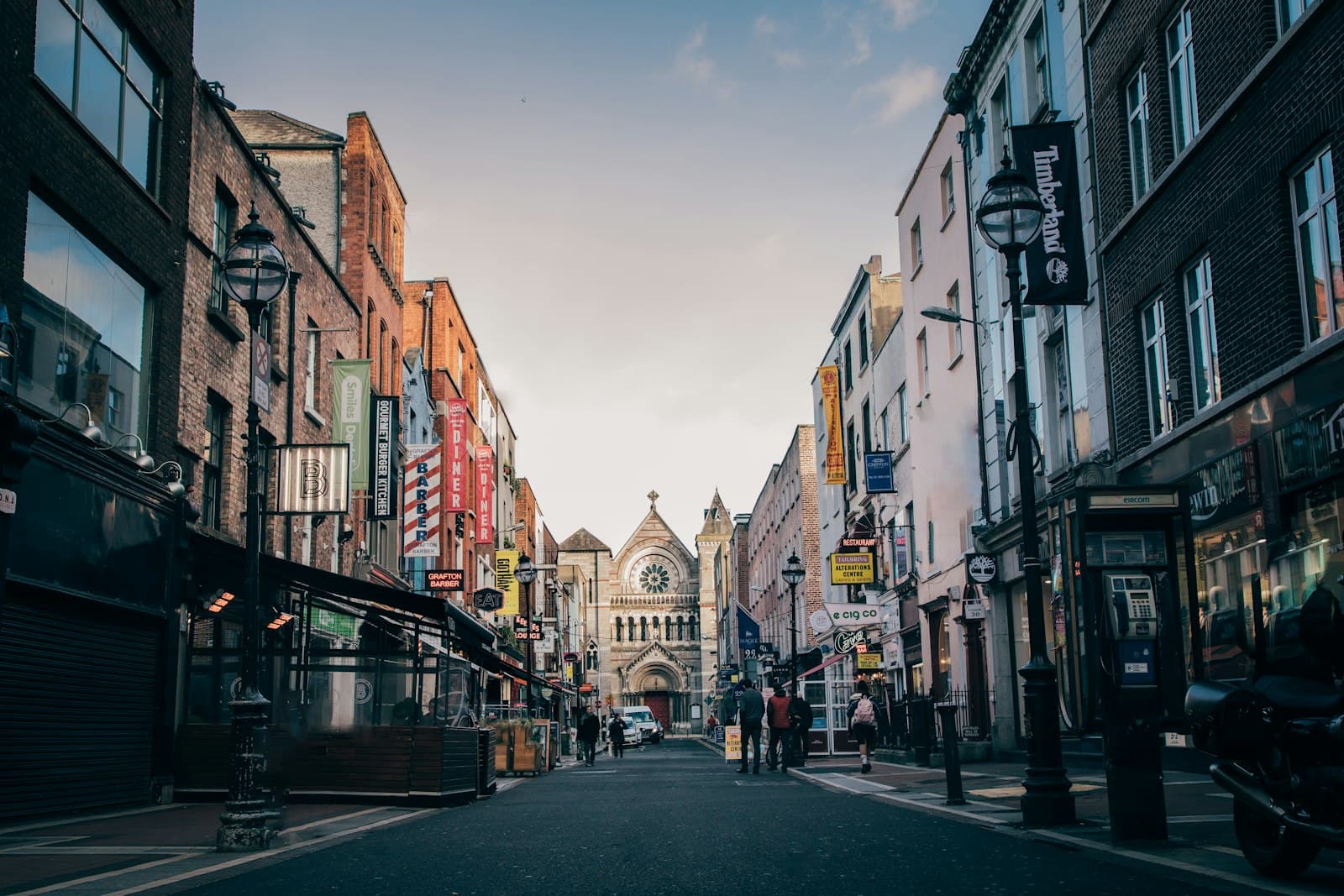 Dublin — people walking on street heading towards church