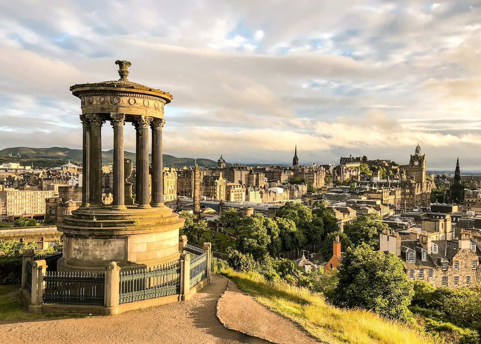 Edinburgh — brown concrete house bell under white clouds