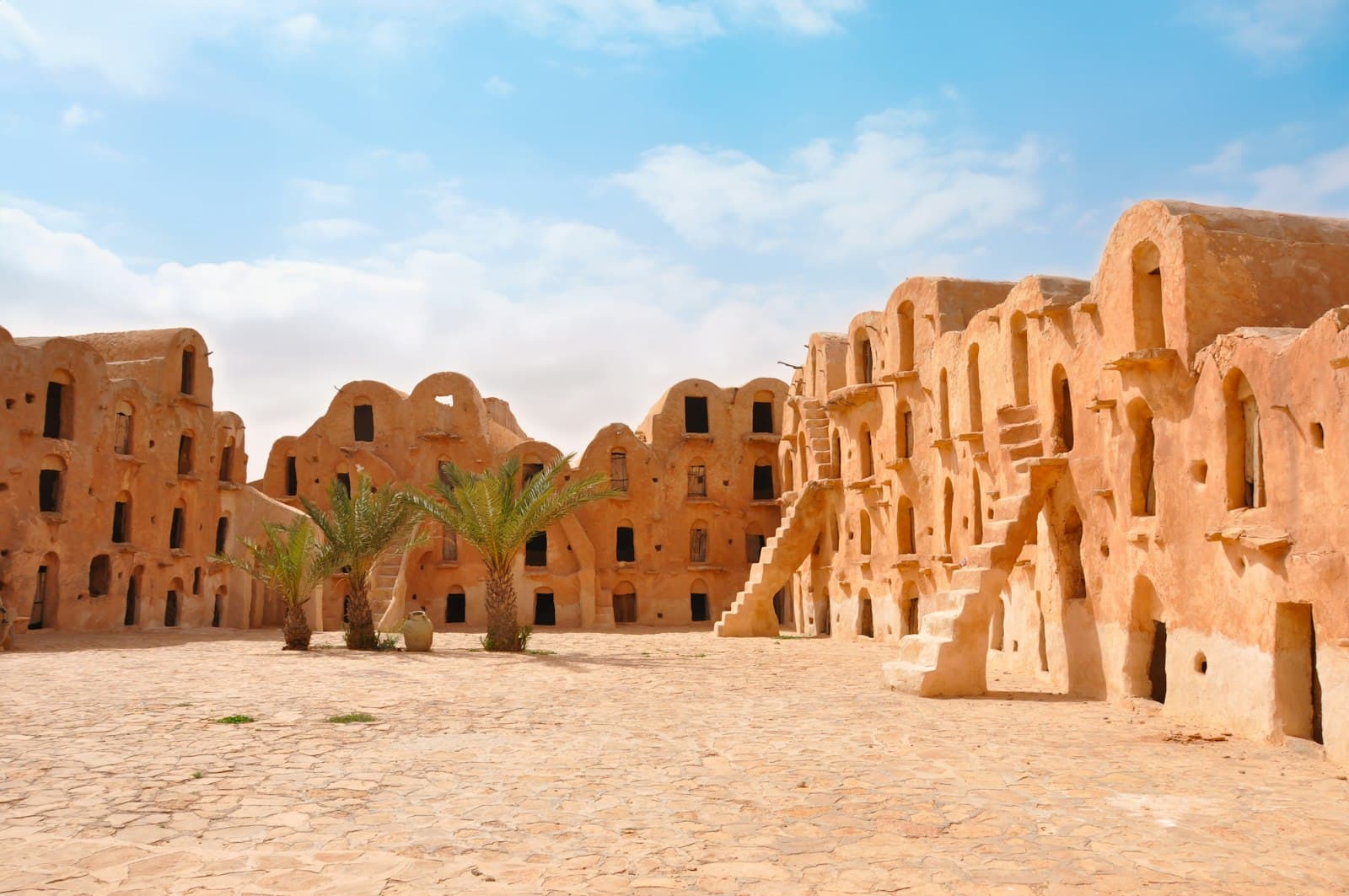 El Djem Amphitheatre — A group of adobe buildings in the desert