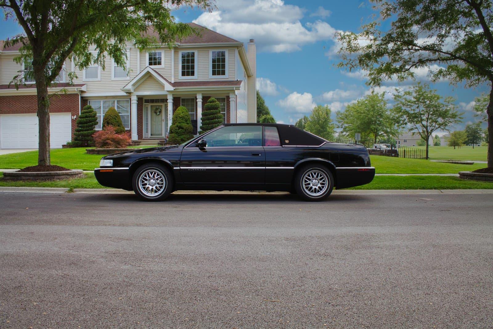 Elgin — a black car parked in front of a house