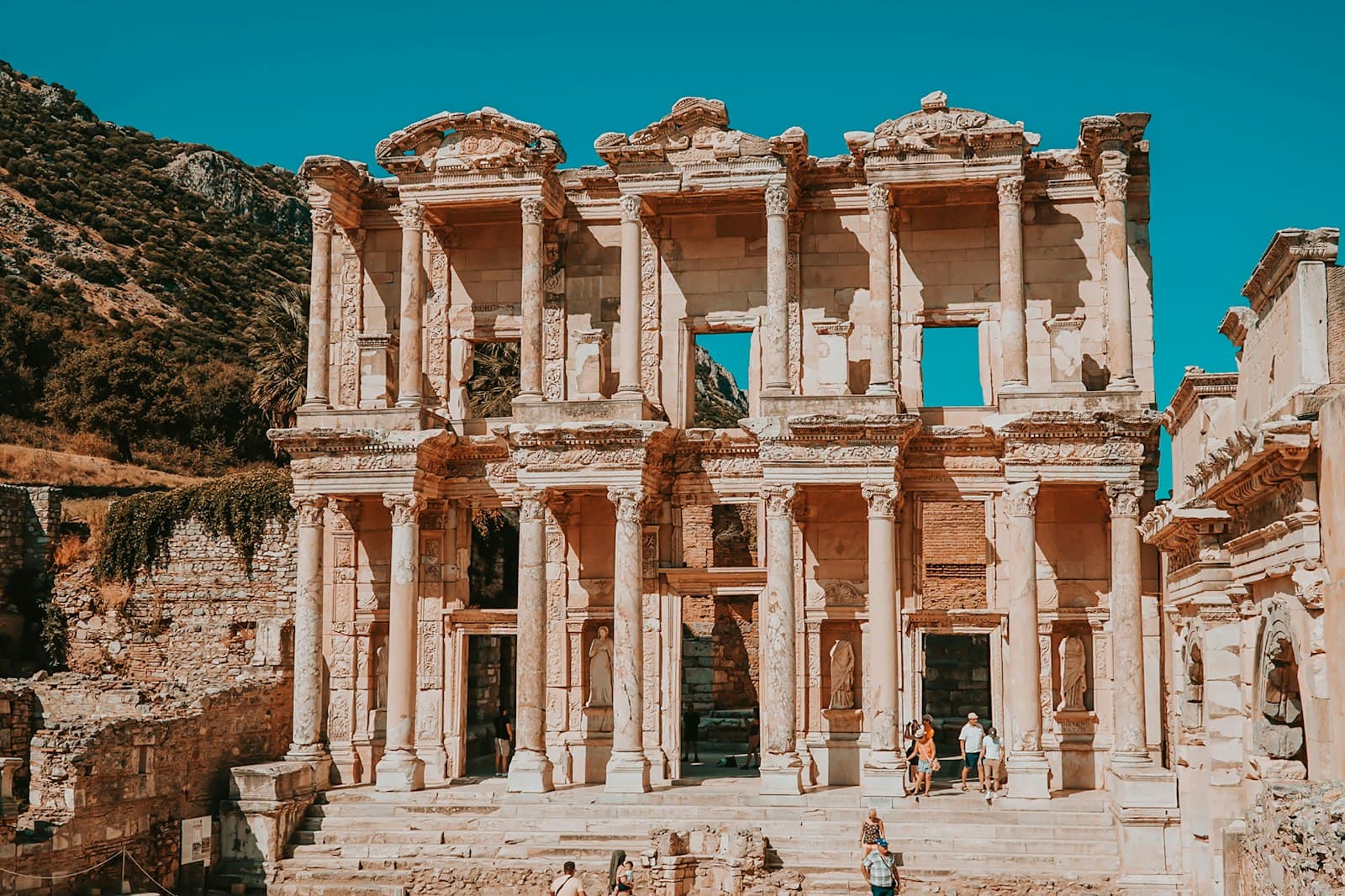 Ephesus — people walking in front of brown concrete building during daytime