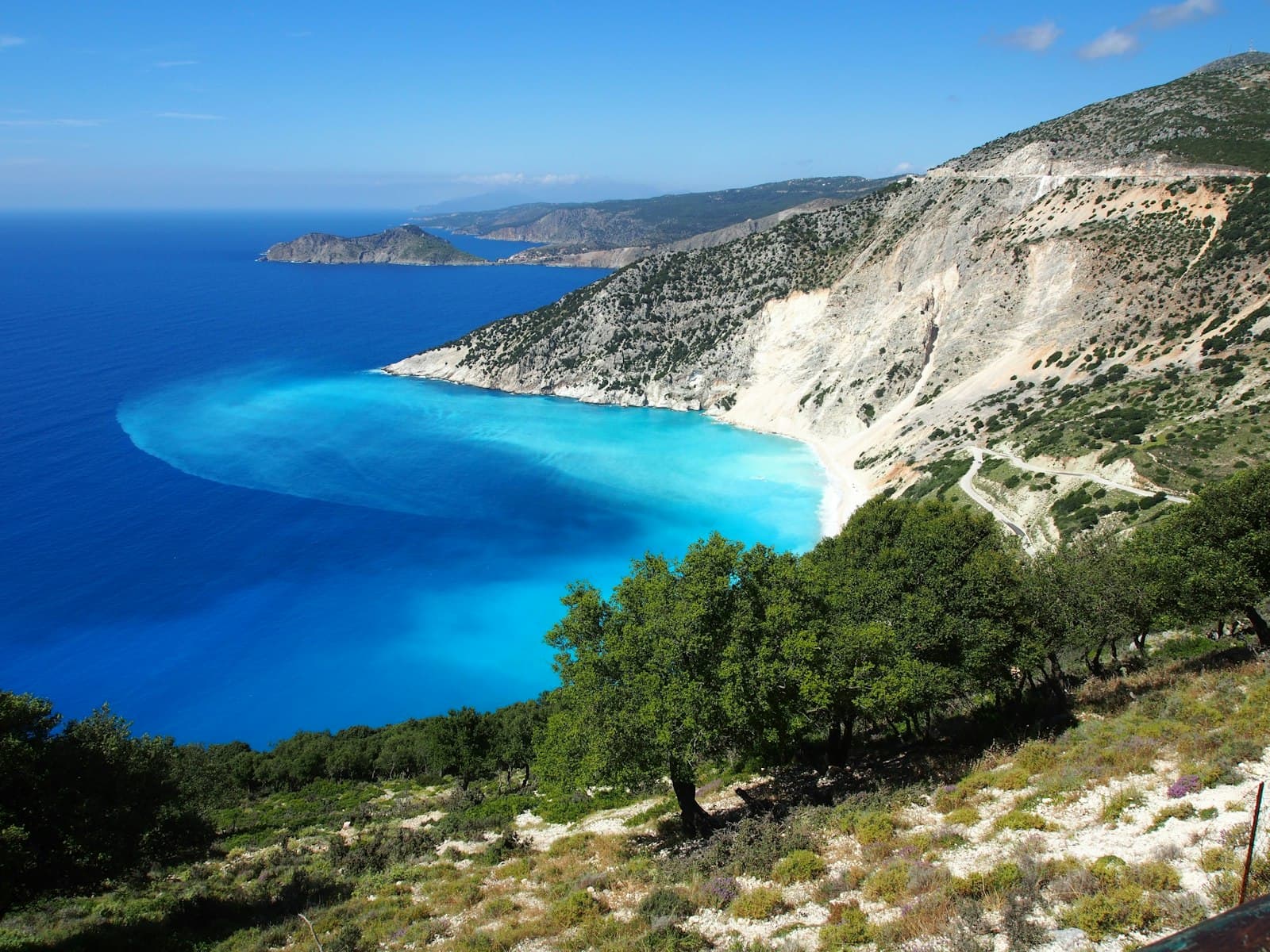 Epidaurus — a body of water with trees and mountains around it