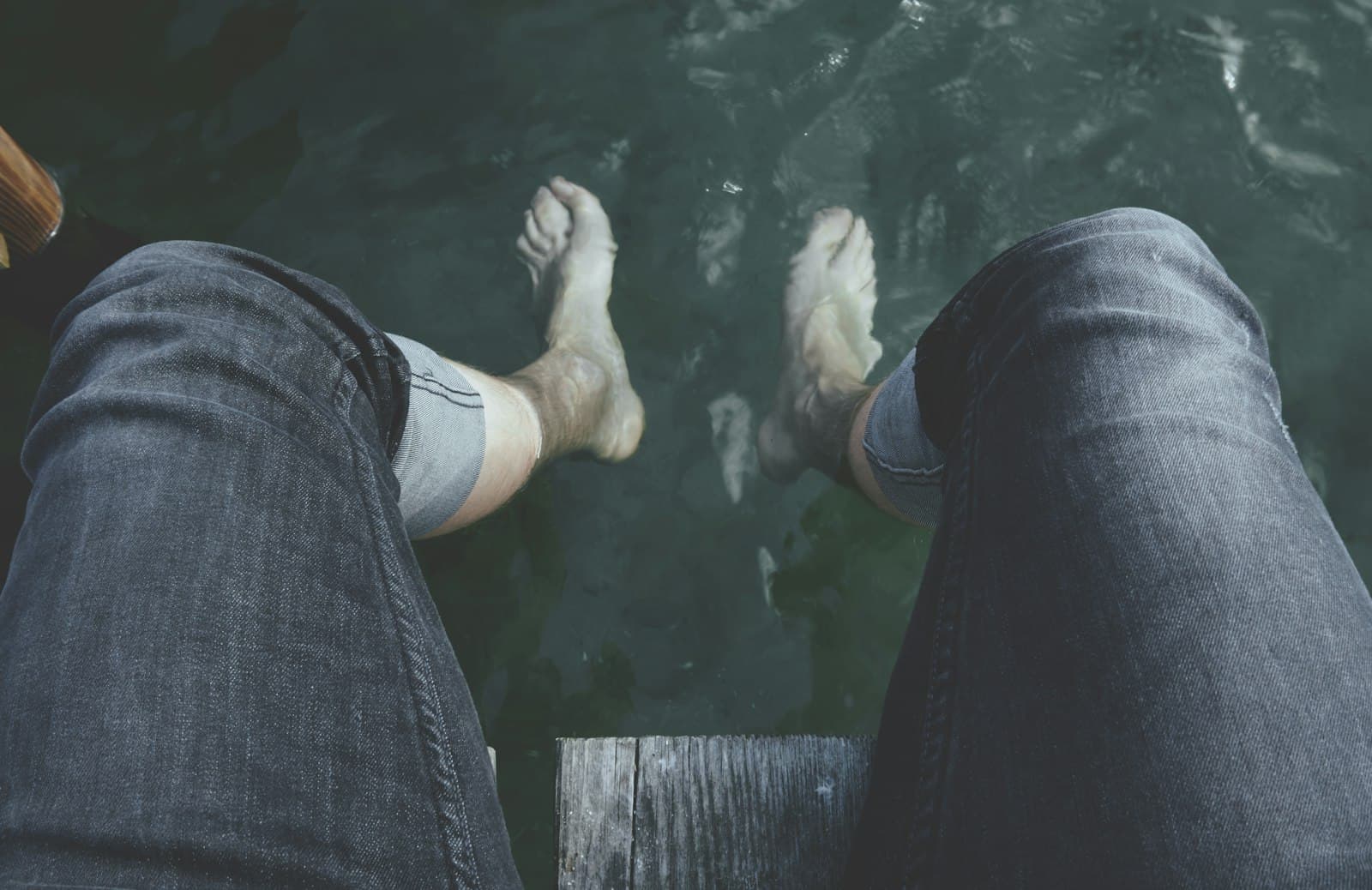 Faaborg — person dangling feet on water